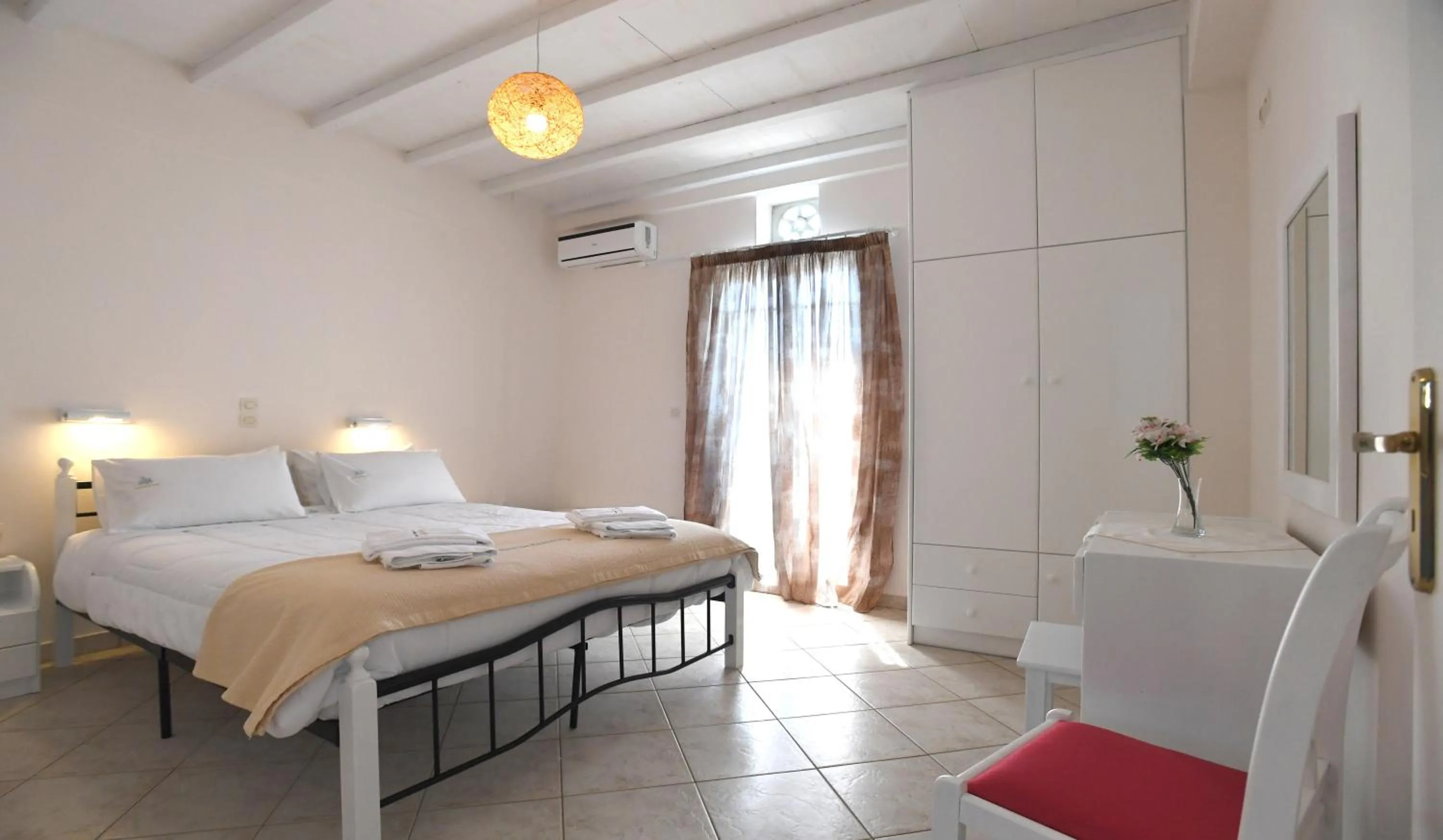Bed in Nostos Beachfront Apartments & Studios