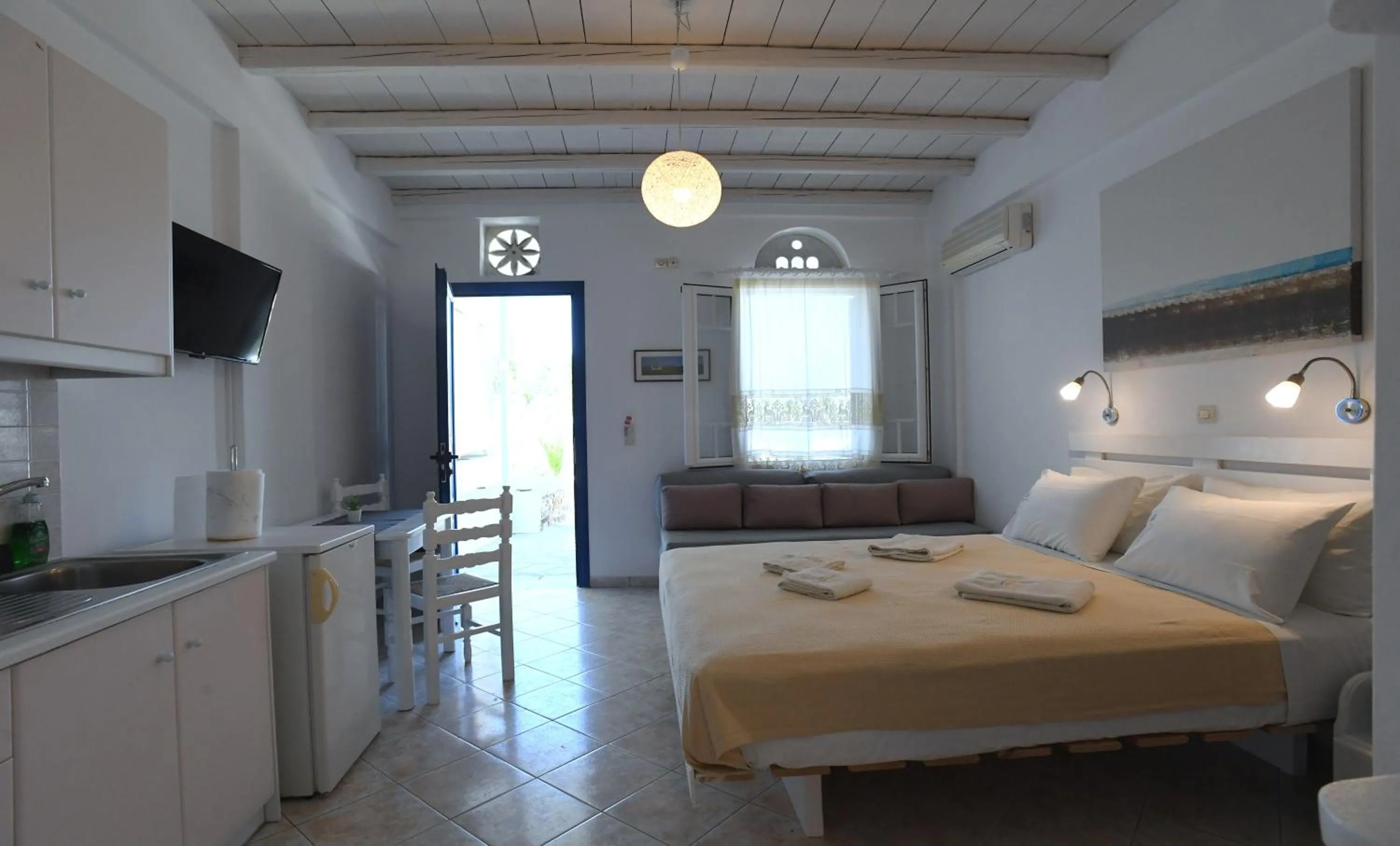 Bed in Nostos Beachfront Apartments & Studios