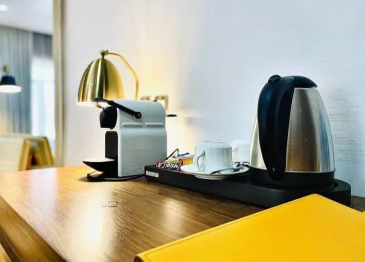 Coffee/tea facilities, Bed in The White Orchid Hotel