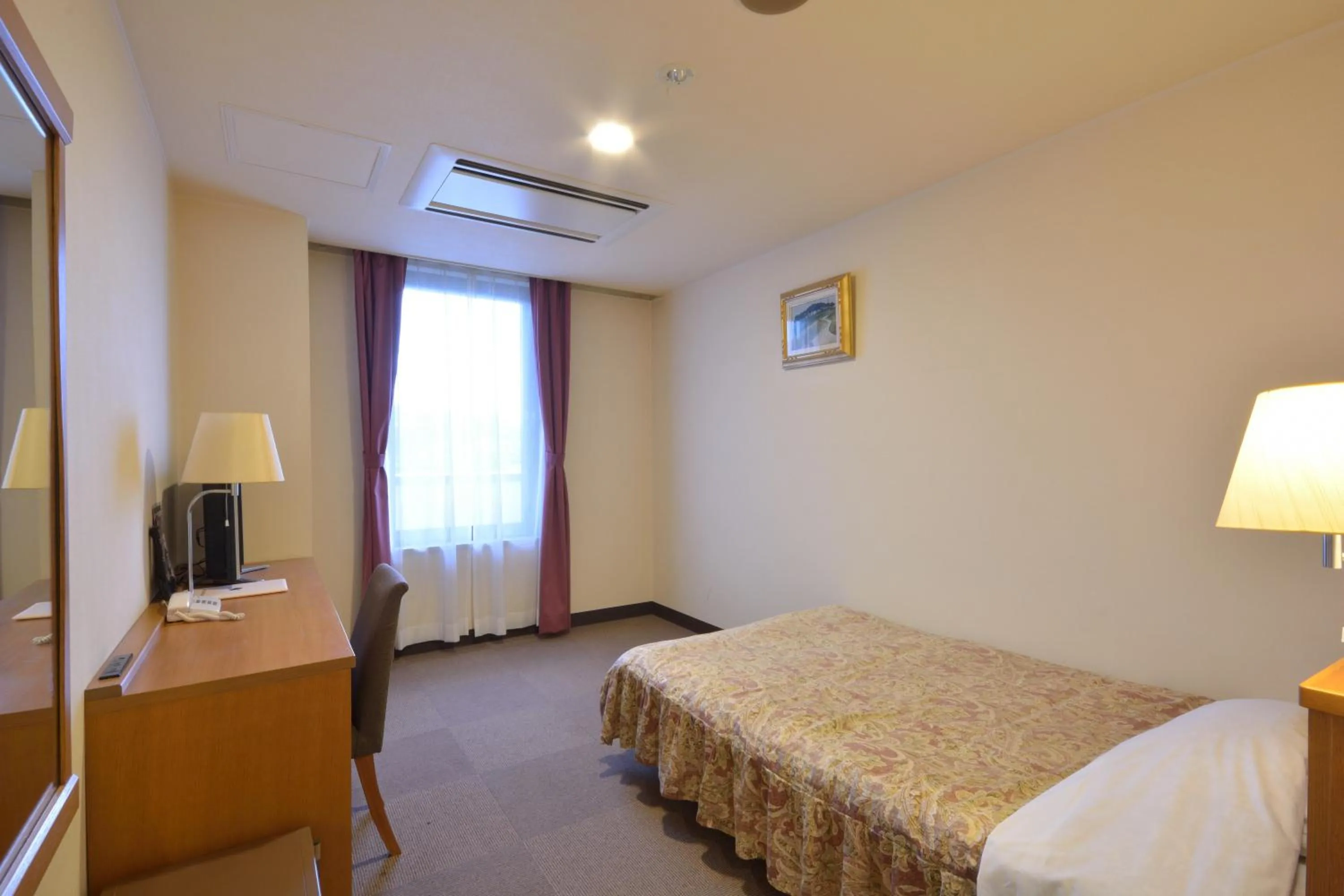 Bed in Daini Prince Hotel Muroran View