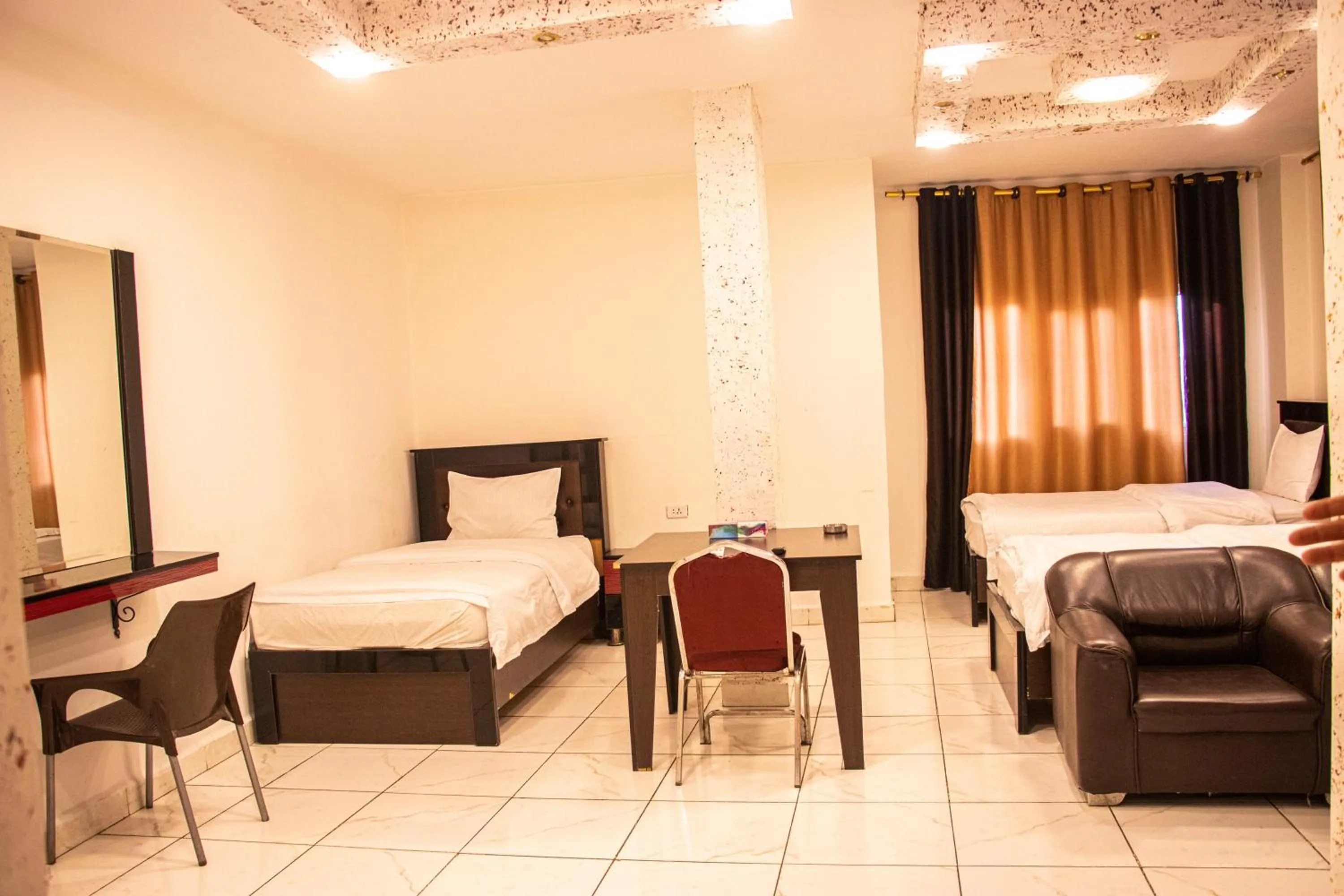 Bed in Sara Crown Hotel