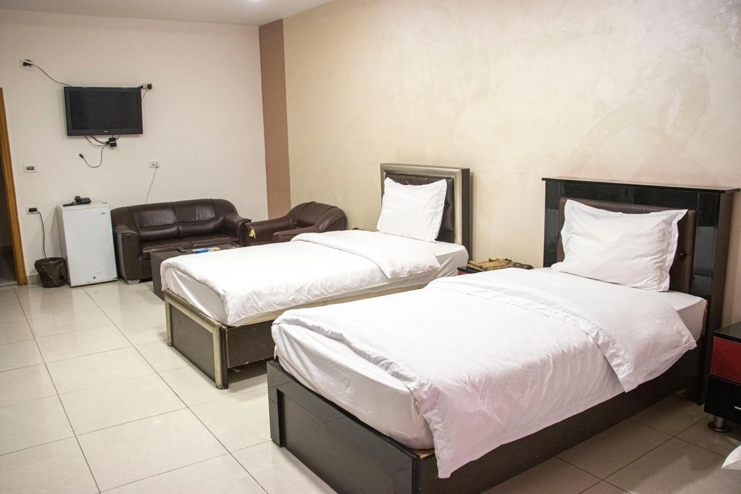 Bed in Sara Crown Hotel