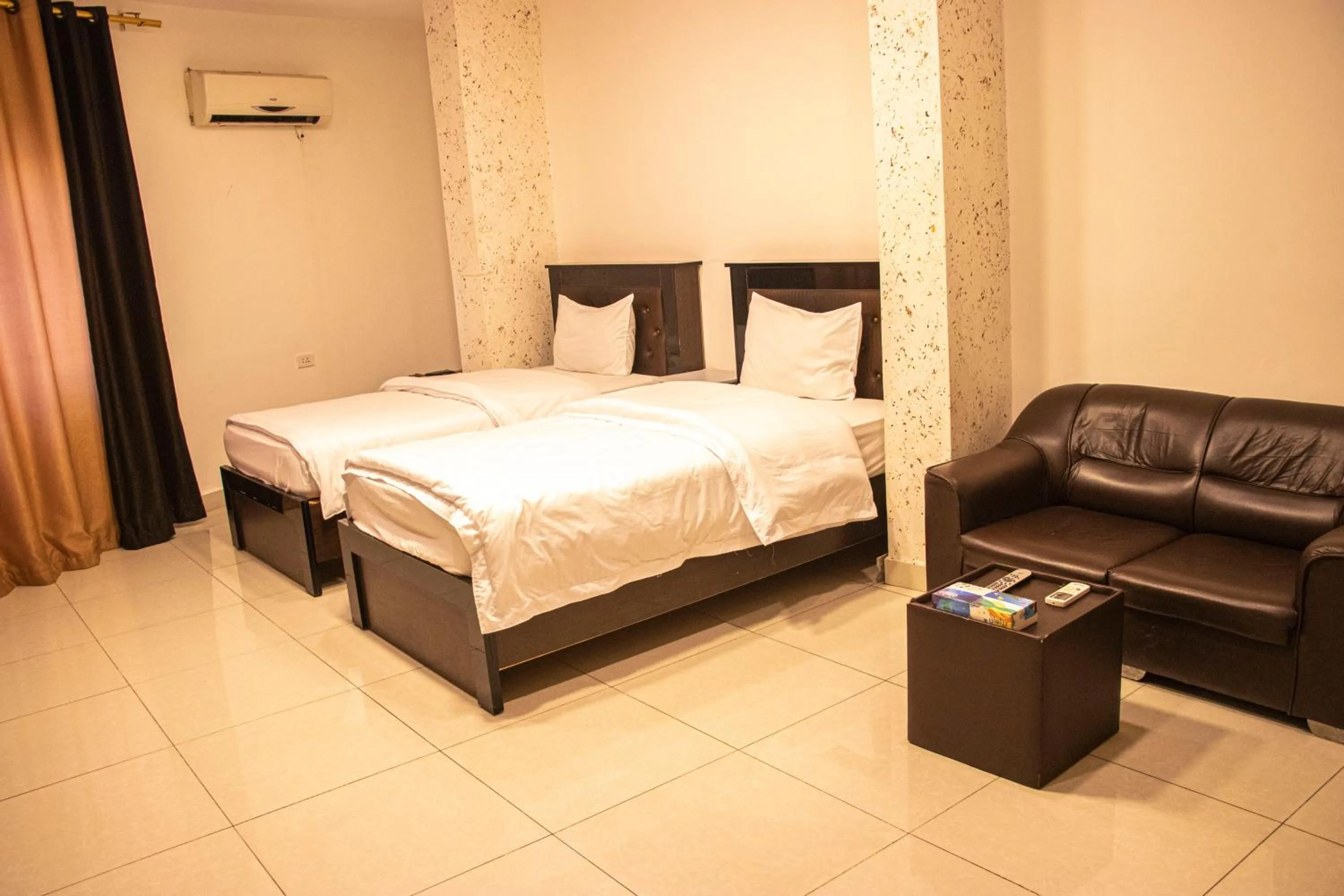 Bed in Sara Crown Hotel