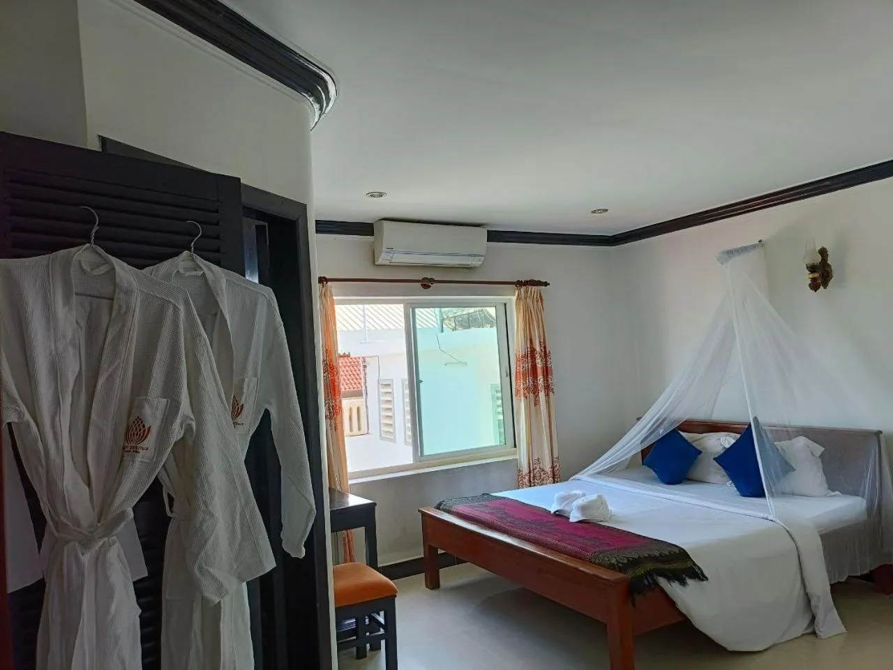 Bed in Parent Heritage Angkor Villa