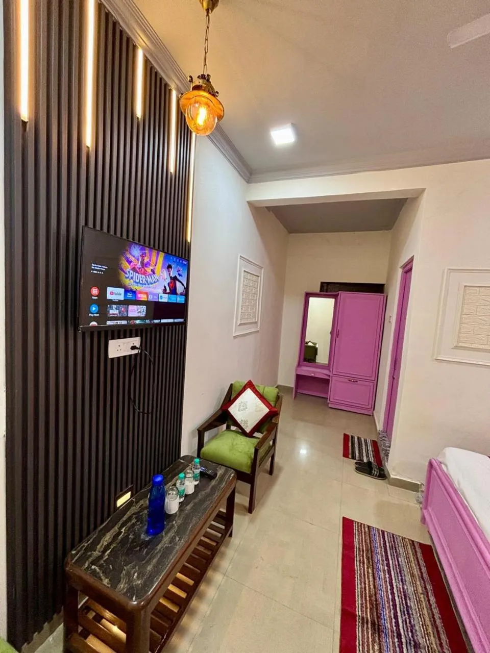 Communal lounge/ TV room, Bed in Hotel Amar