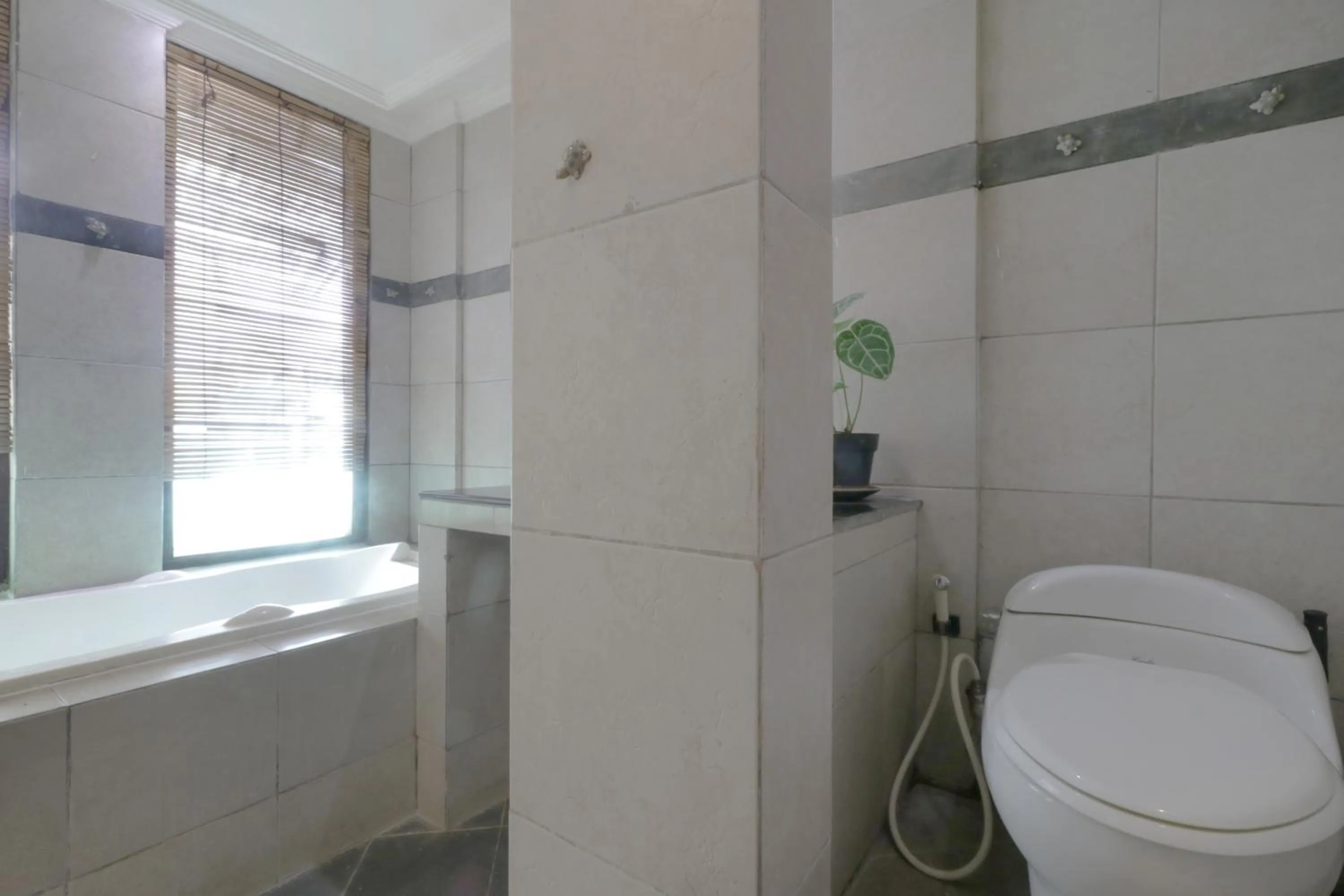 Bathroom in NILA HOUSE, Sharia Family Home Stay