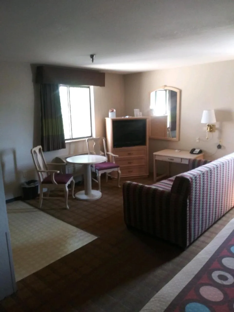 Seating area in Super 8 by Wyndham Albuquerque West/Coors Blvd