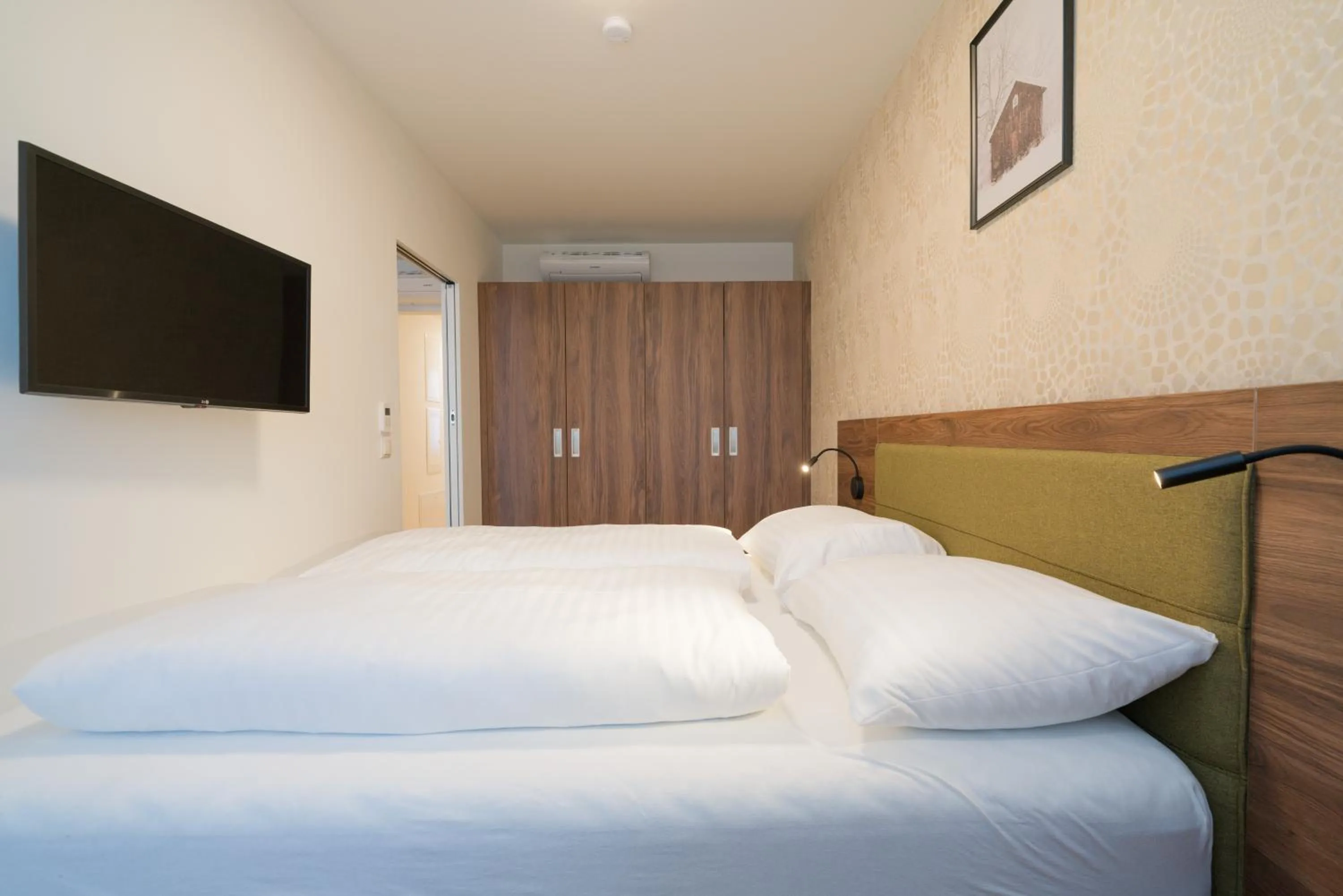 Communal lounge/ TV room, Bed in MyApartments Vienna