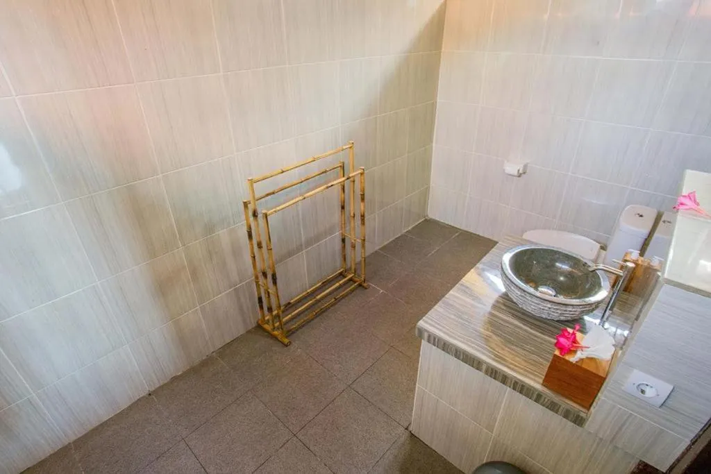 Toilet in Ocean Paradise Cottage