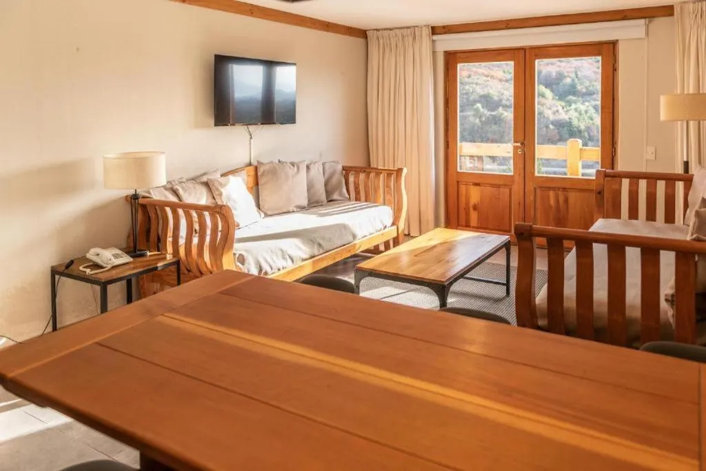 Living room, Bed in Hostería del Cerro