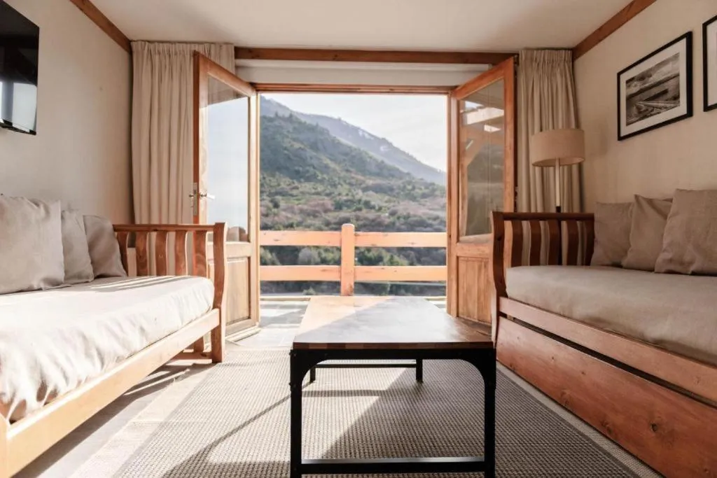 Living room, Bed in Hostería del Cerro