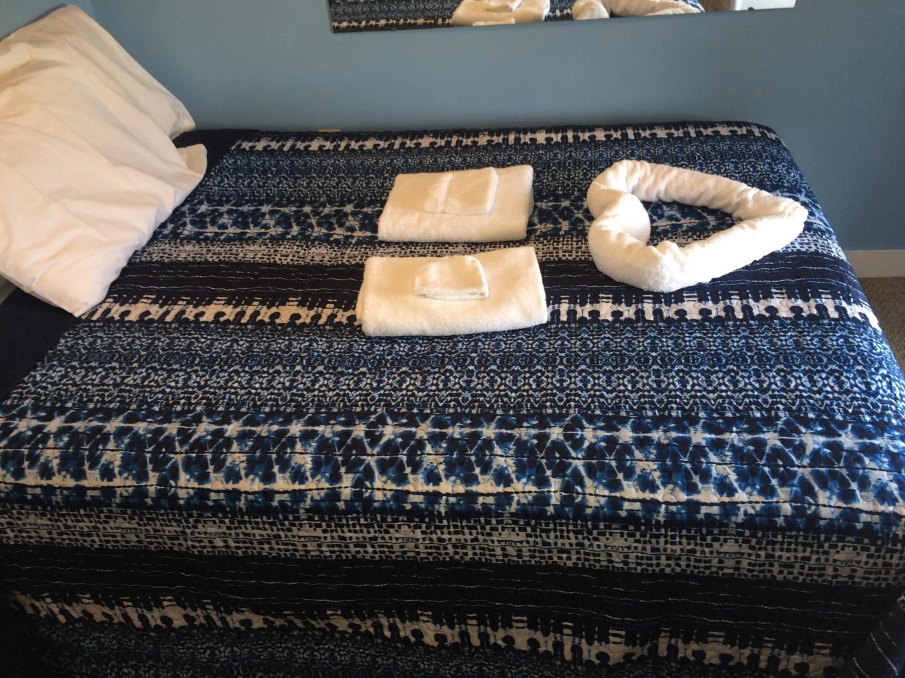 Bed in The New Oceanic Inn