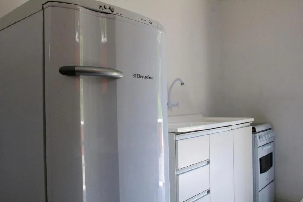 Kitchen or kitchenette in Pousada Residencial Família Dragone