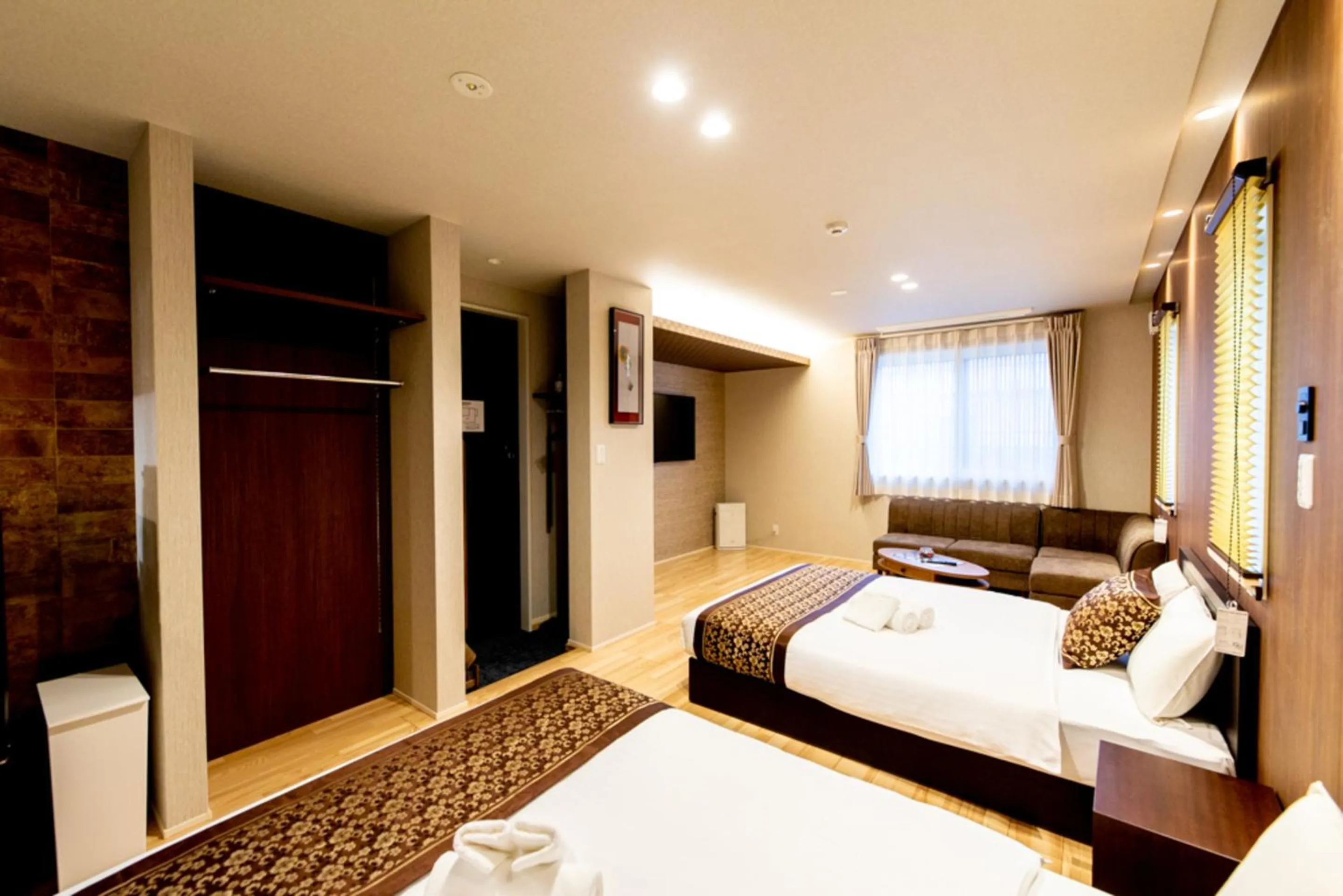 Photo of the whole room, Bed in GRAND BASE Hiroshima Hikarimachi