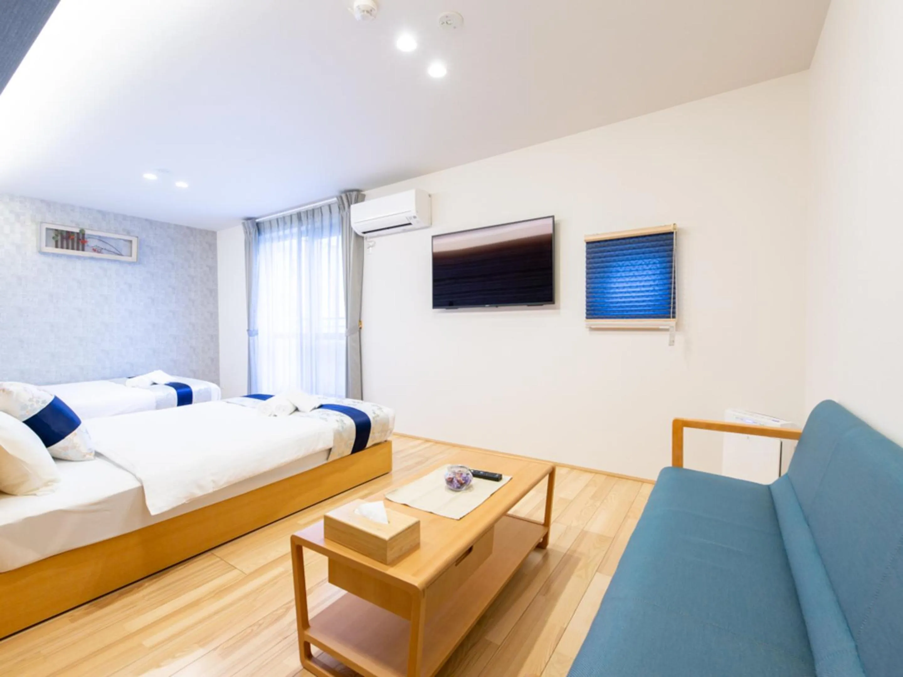 Photo of the whole room, Bed in GRAND BASE Hiroshima Hikarimachi