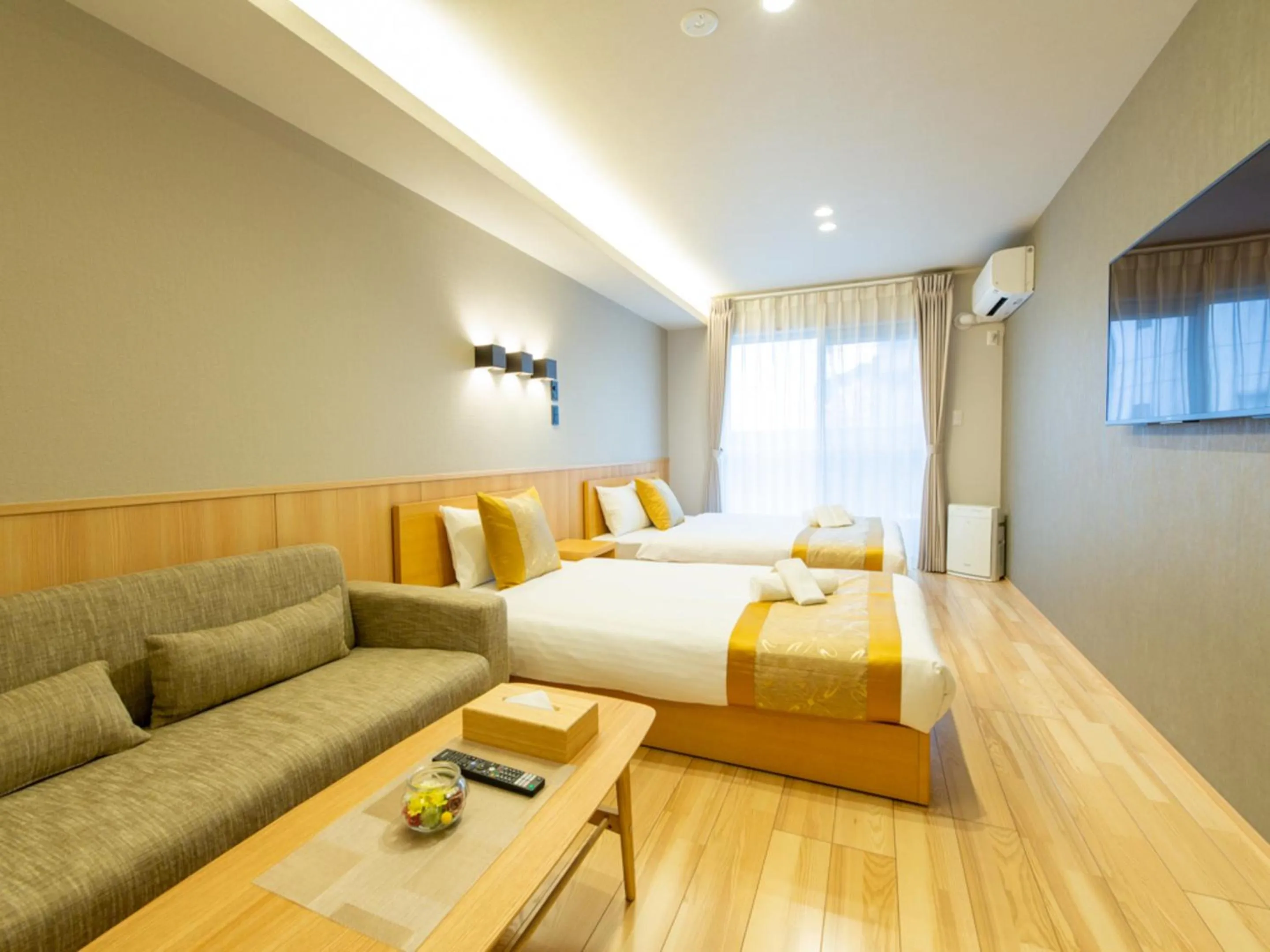 Photo of the whole room, Bed in GRAND BASE Hiroshima Hikarimachi