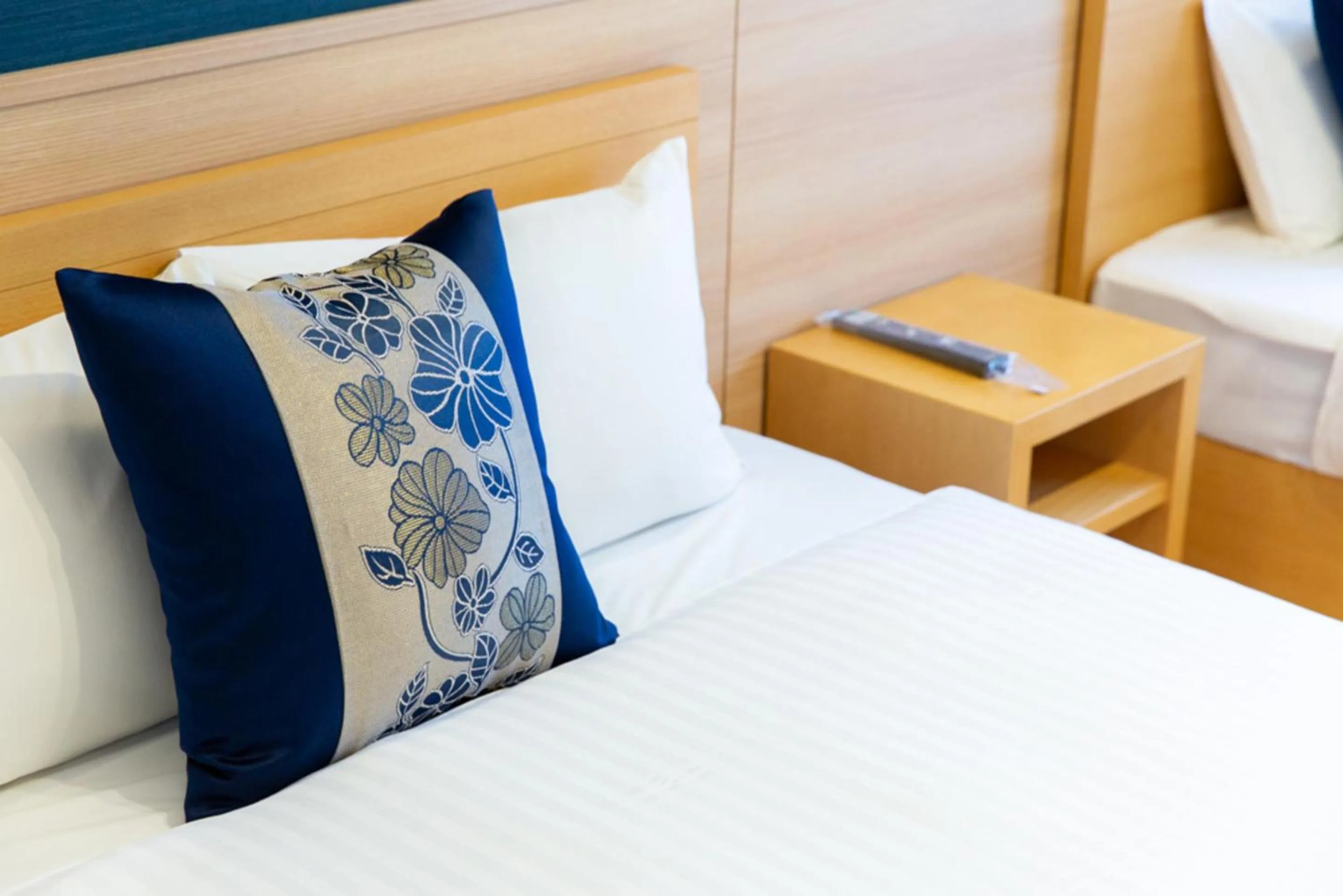 Bed in GRAND BASE Hiroshima Hikarimachi