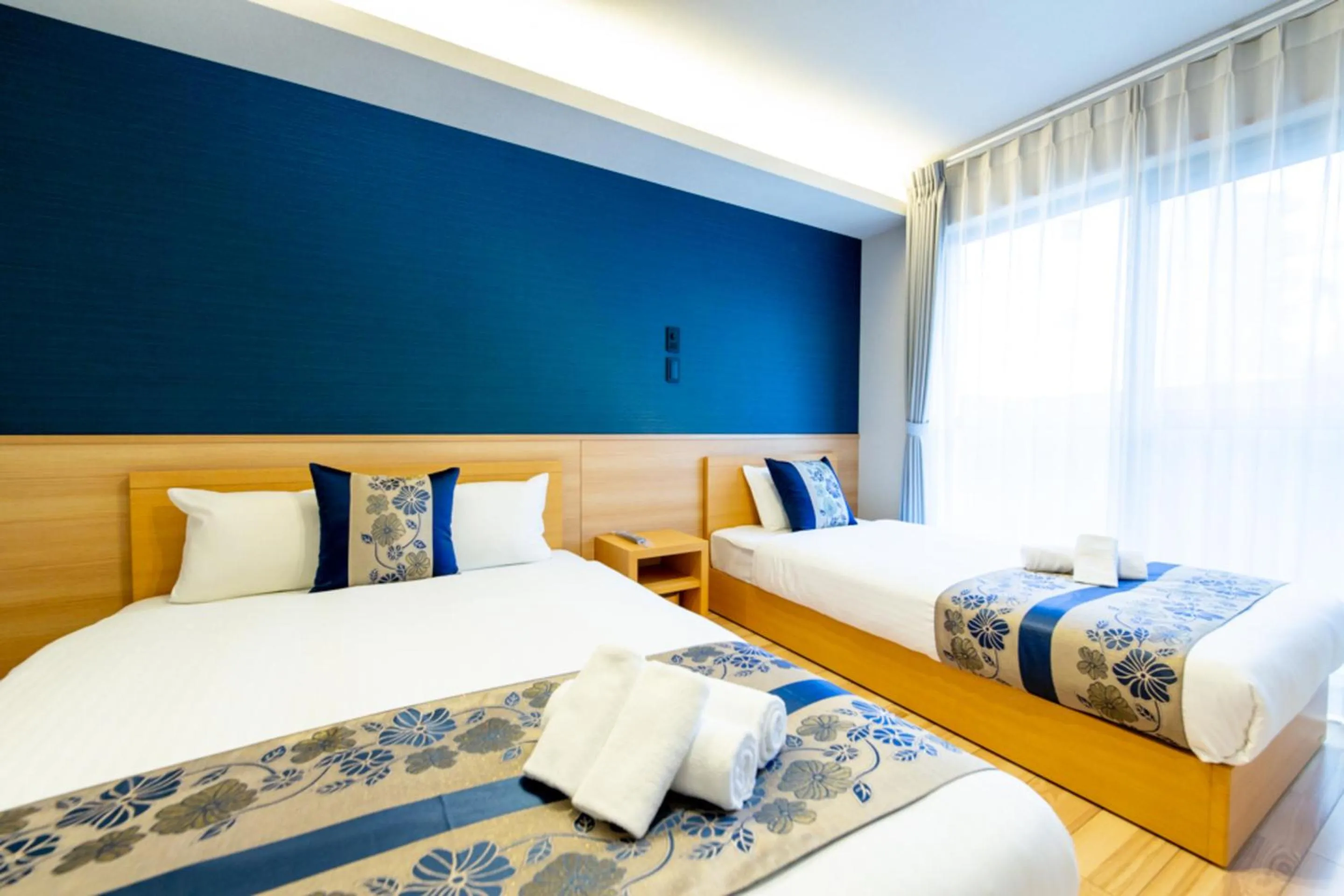 Bed in GRAND BASE Hiroshima Hikarimachi