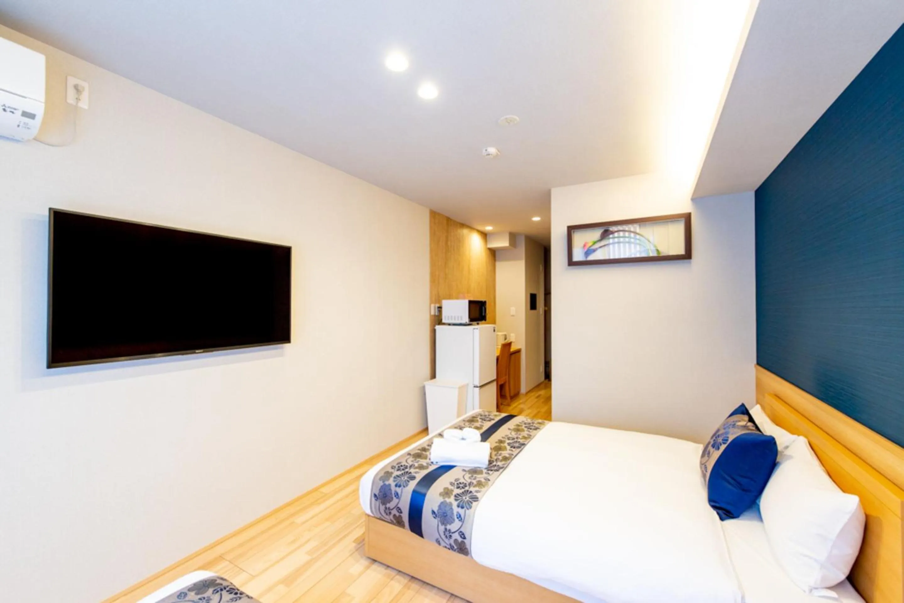 Photo of the whole room, Bed in GRAND BASE Hiroshima Hikarimachi