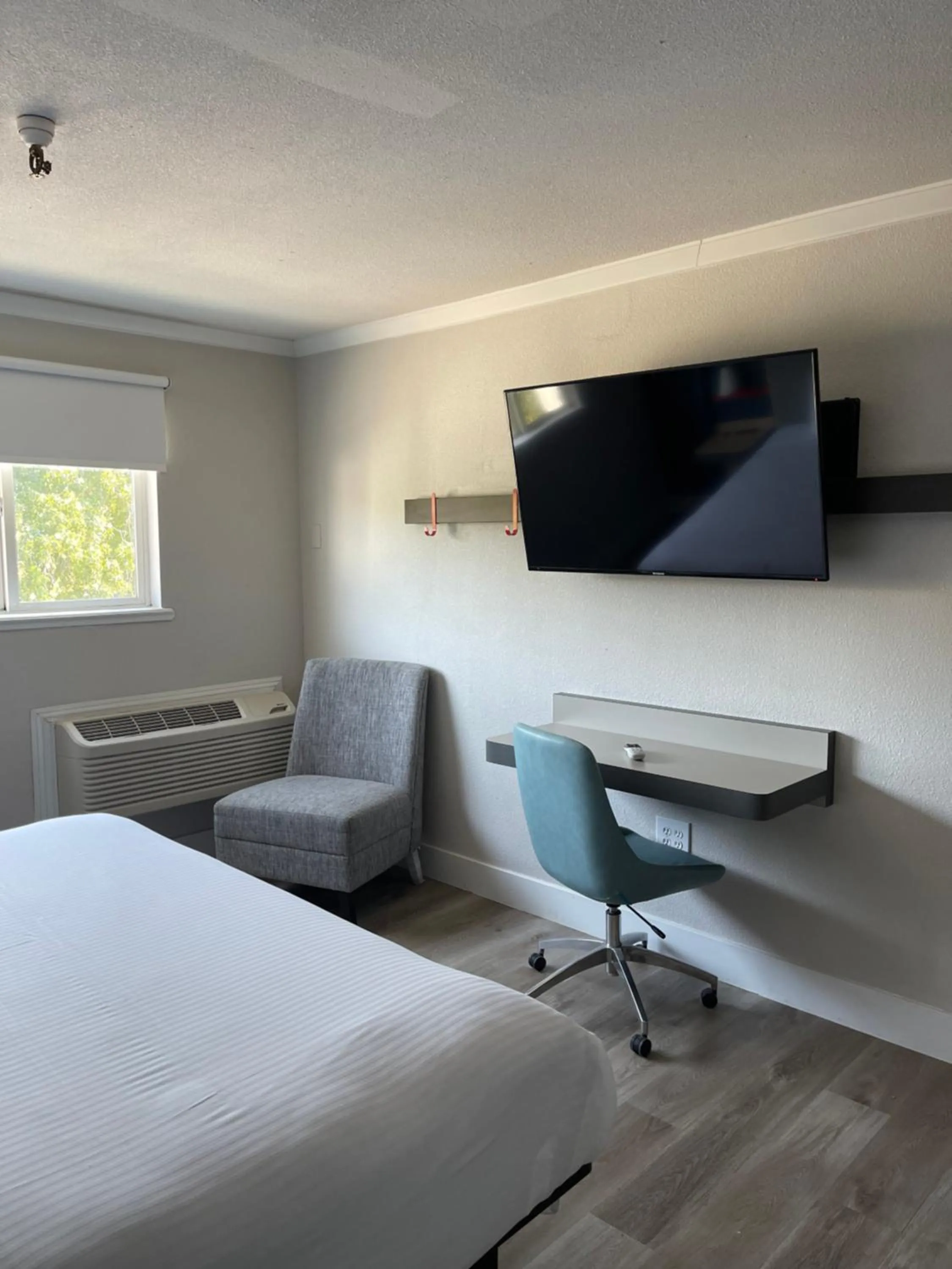 Bed in The Midtowner Hotel, SureStay Collection by Best Western