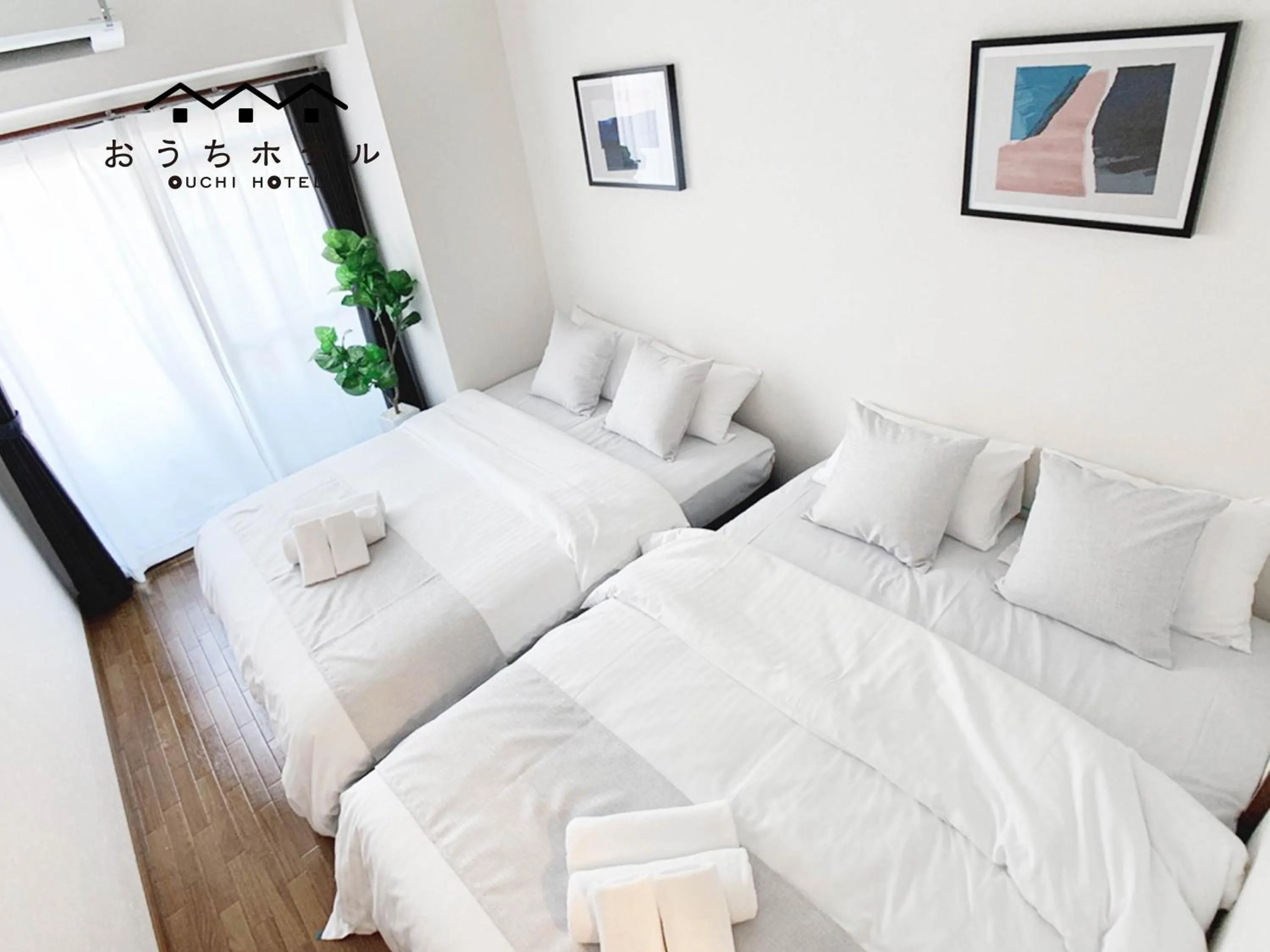 Bed in OUCHI HOTEL Dambara