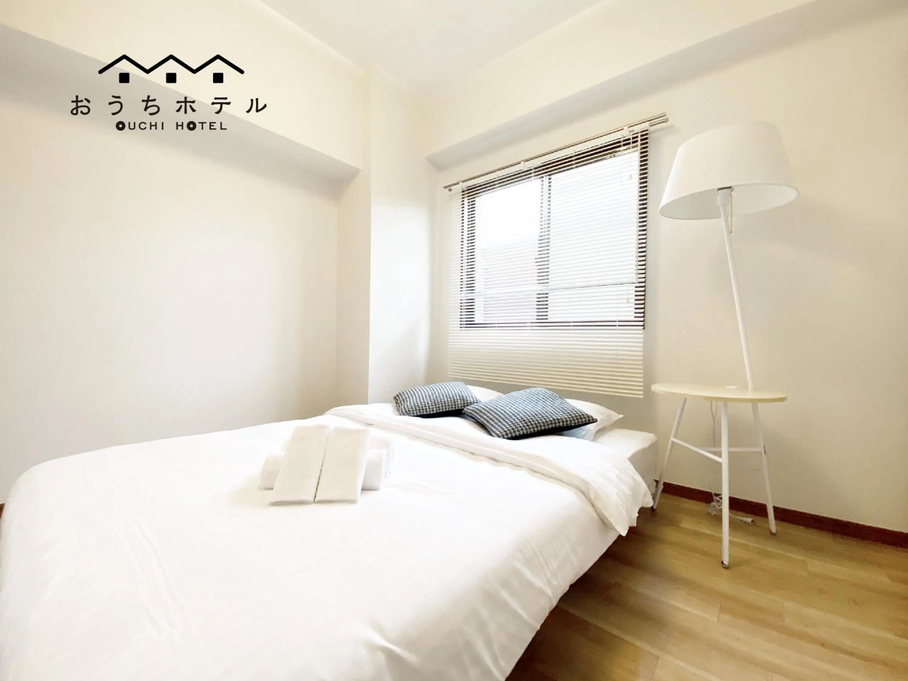 Bed in OUCHI HOTEL Dambara