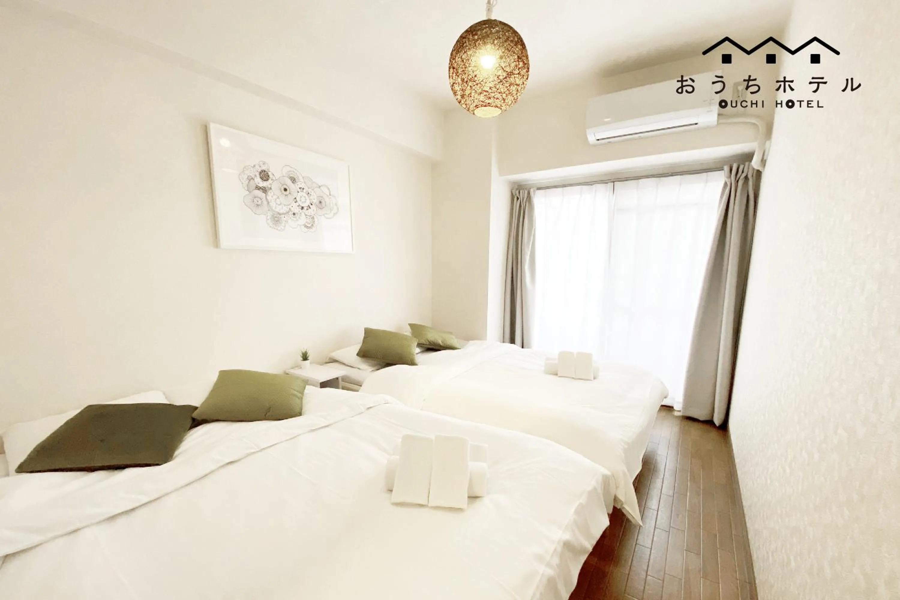 Bed in OUCHI HOTEL Dambara