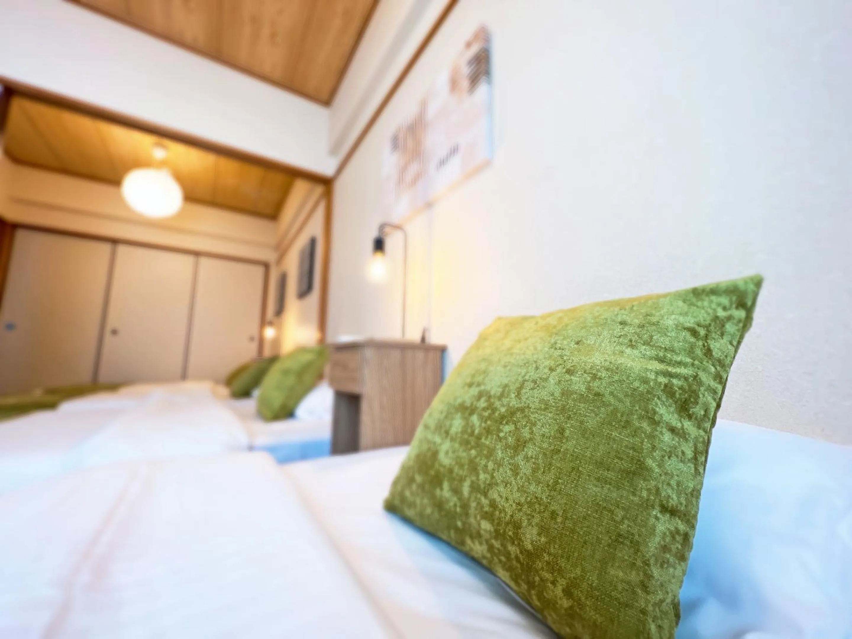 Bed in OUCHI HOTEL Dambara