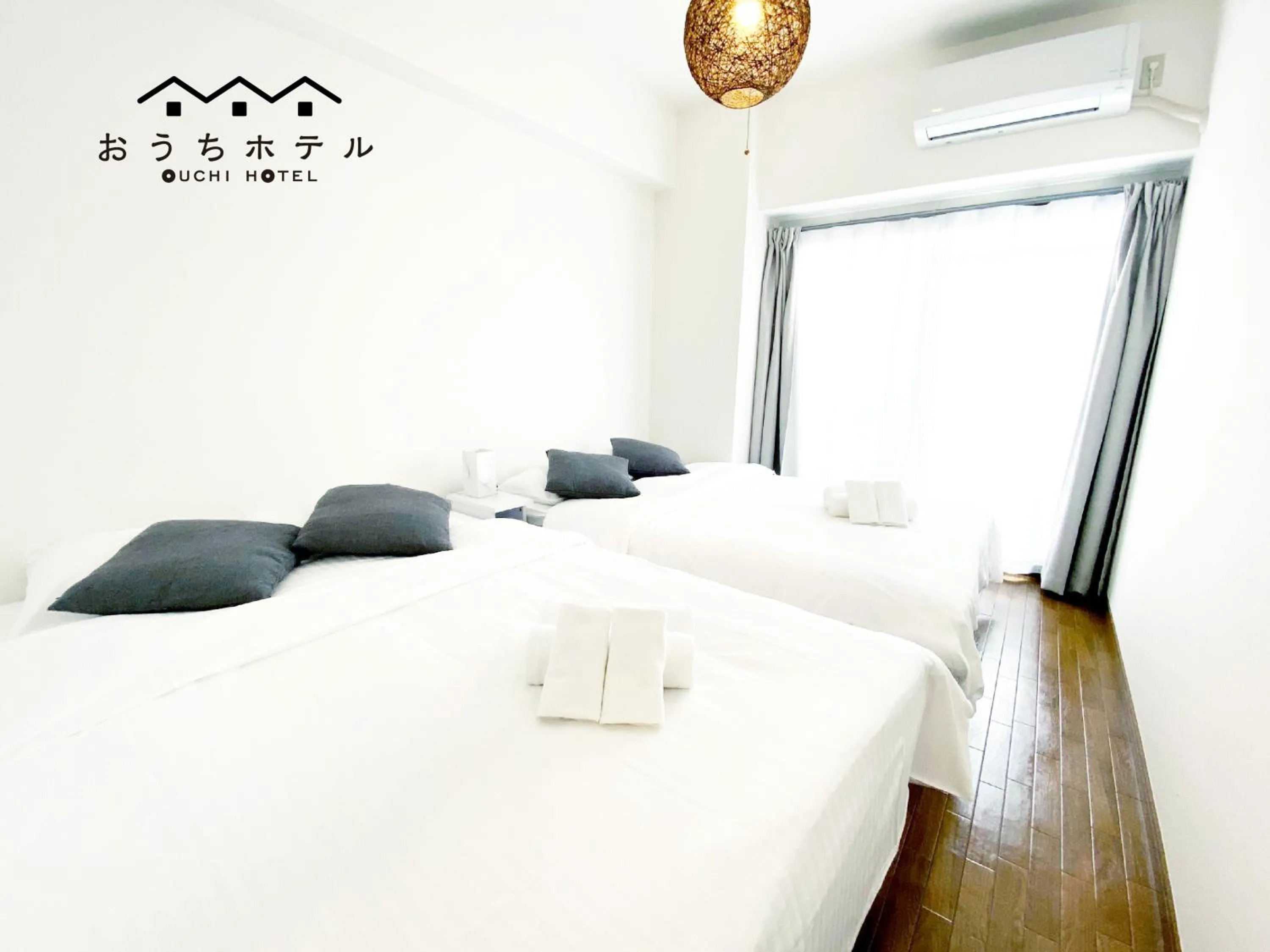 Bed in OUCHI HOTEL Dambara