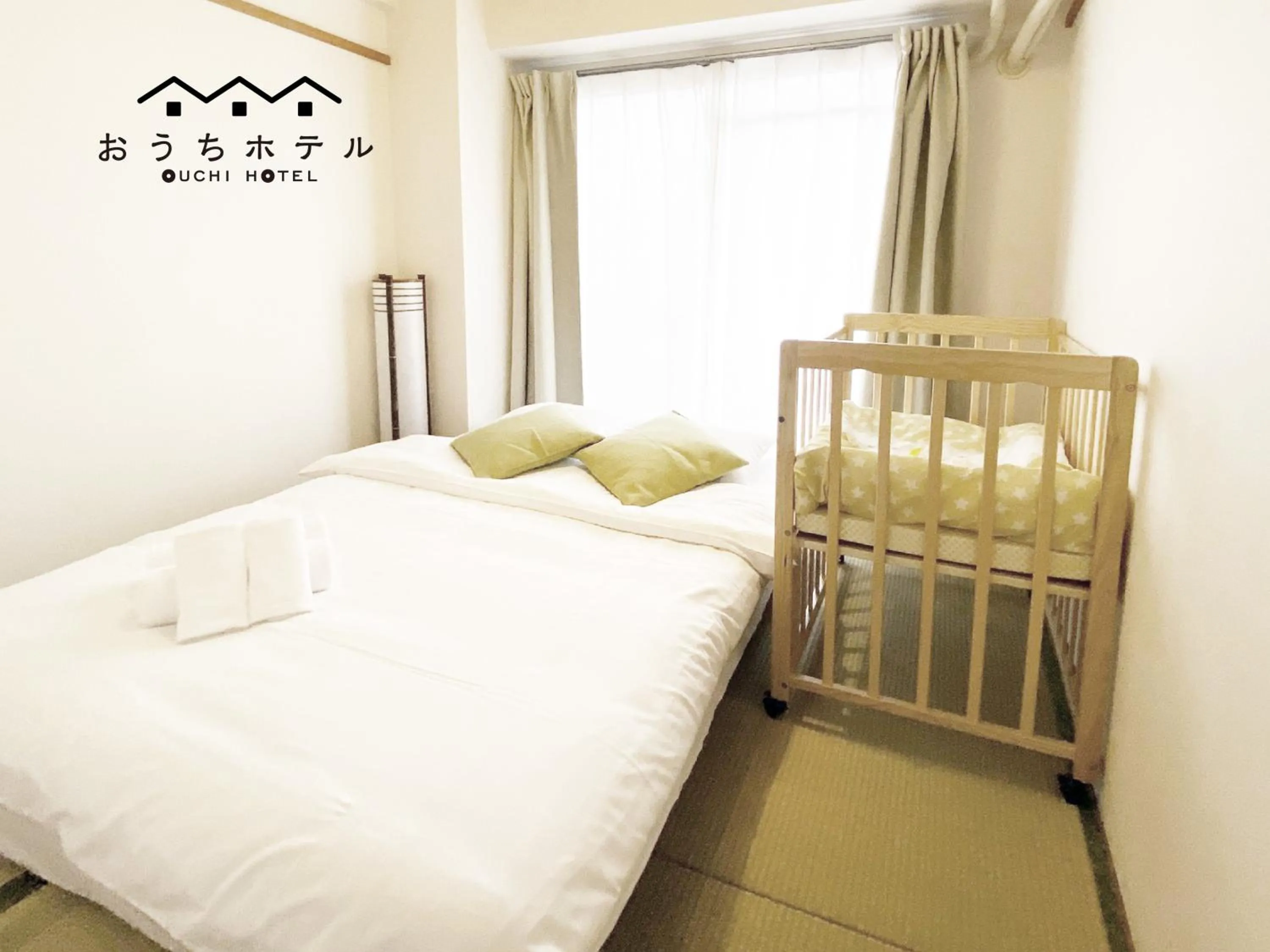 Bed in OUCHI HOTEL Dambara