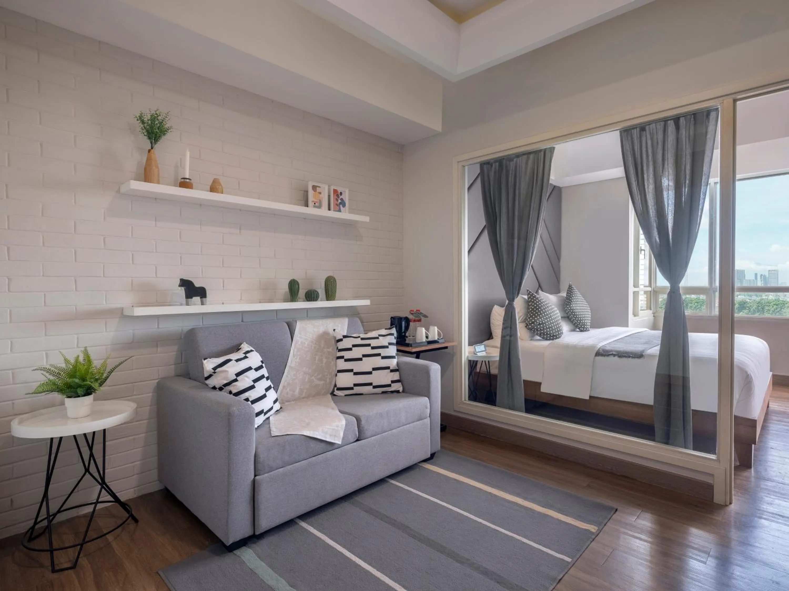 Living room, Bed in Fika Rooms Tangerang By Skandinavia