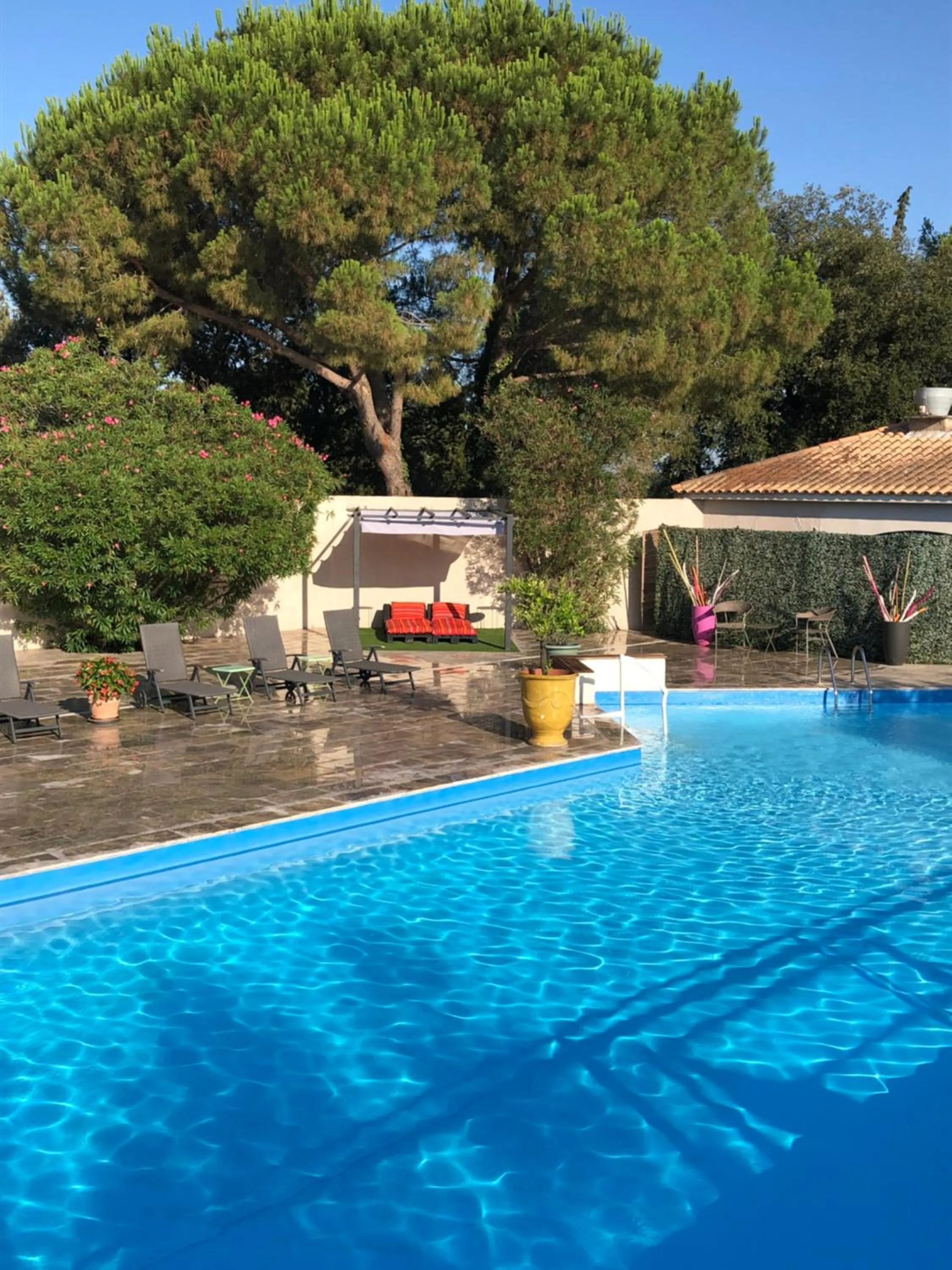 Swimming pool in Logis Hôtel Restaurant Les Aubuns
