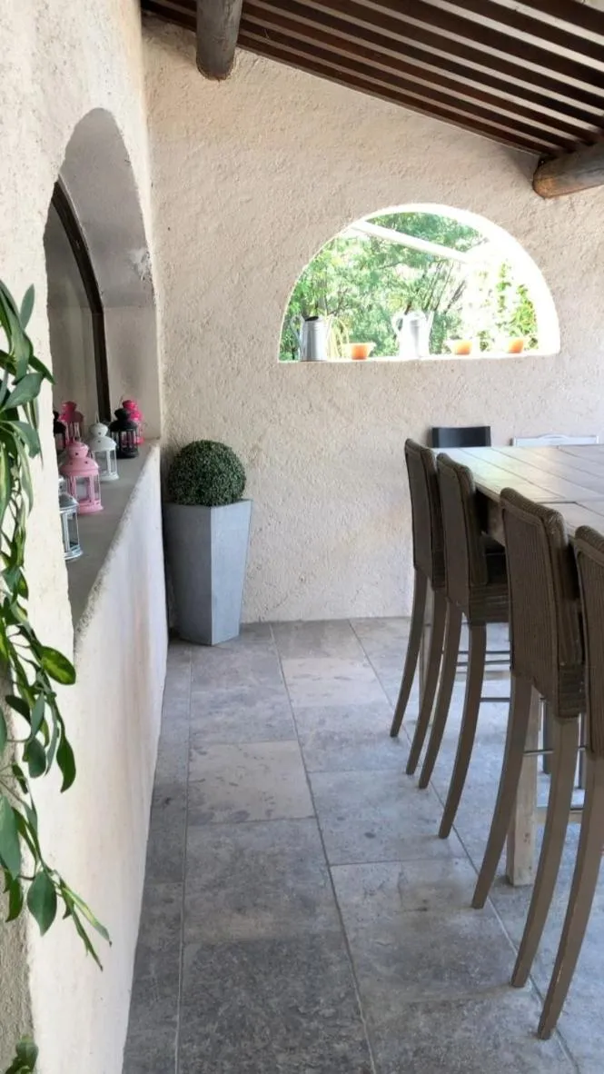 Patio in Logis Hôtel Restaurant Les Aubuns