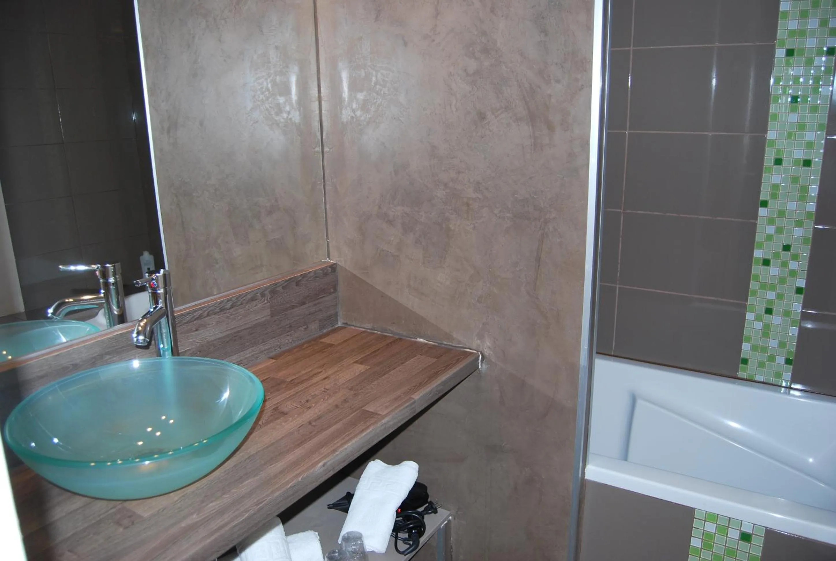 Bathroom in Logis Hôtel Restaurant Les Aubuns