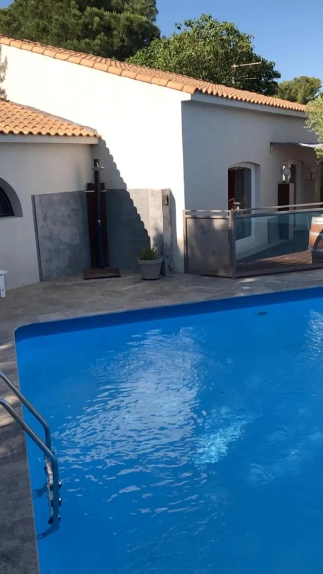 Swimming pool in Logis Hôtel Restaurant Les Aubuns