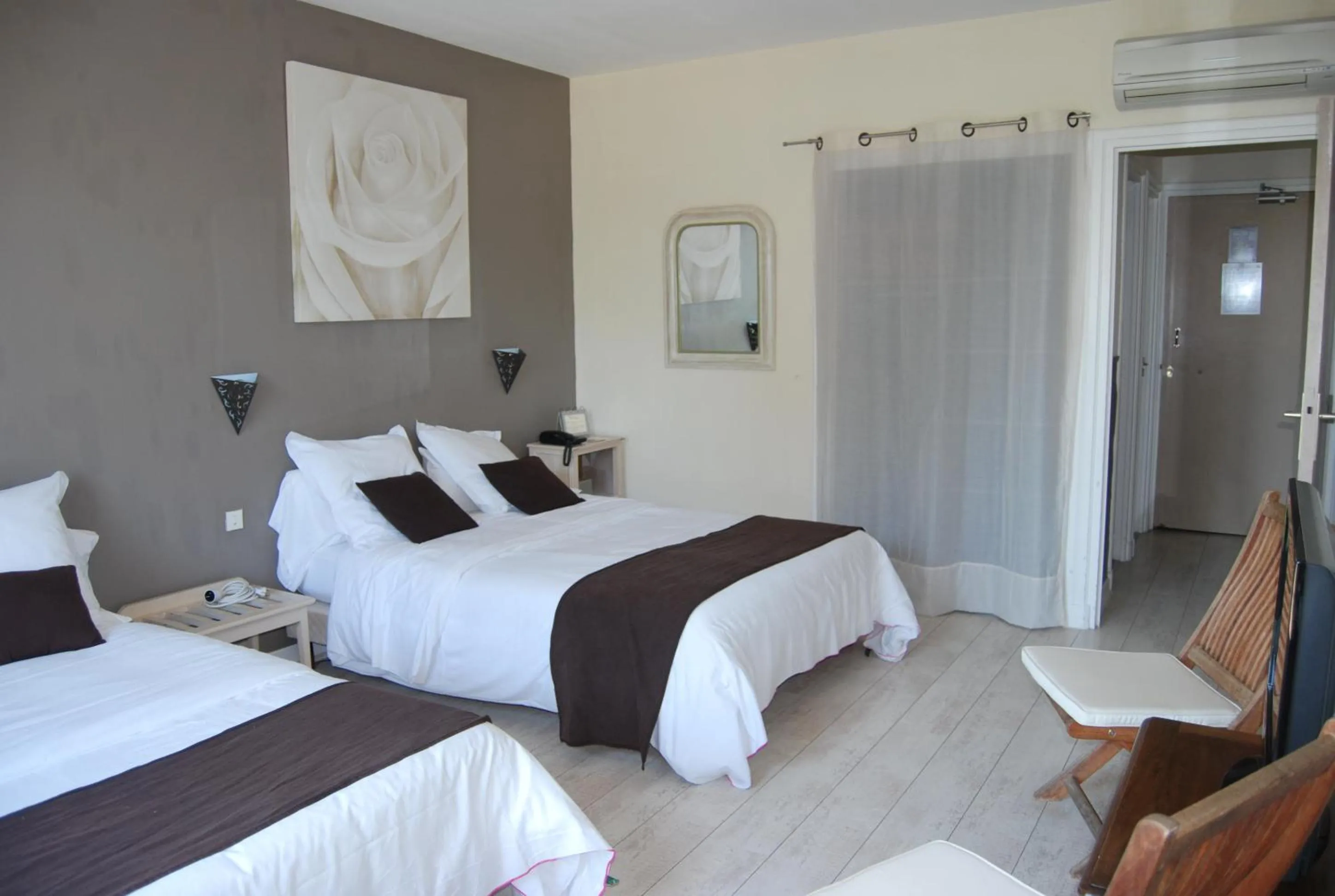 Photo of the whole room, Bed in Logis Hôtel Restaurant Les Aubuns