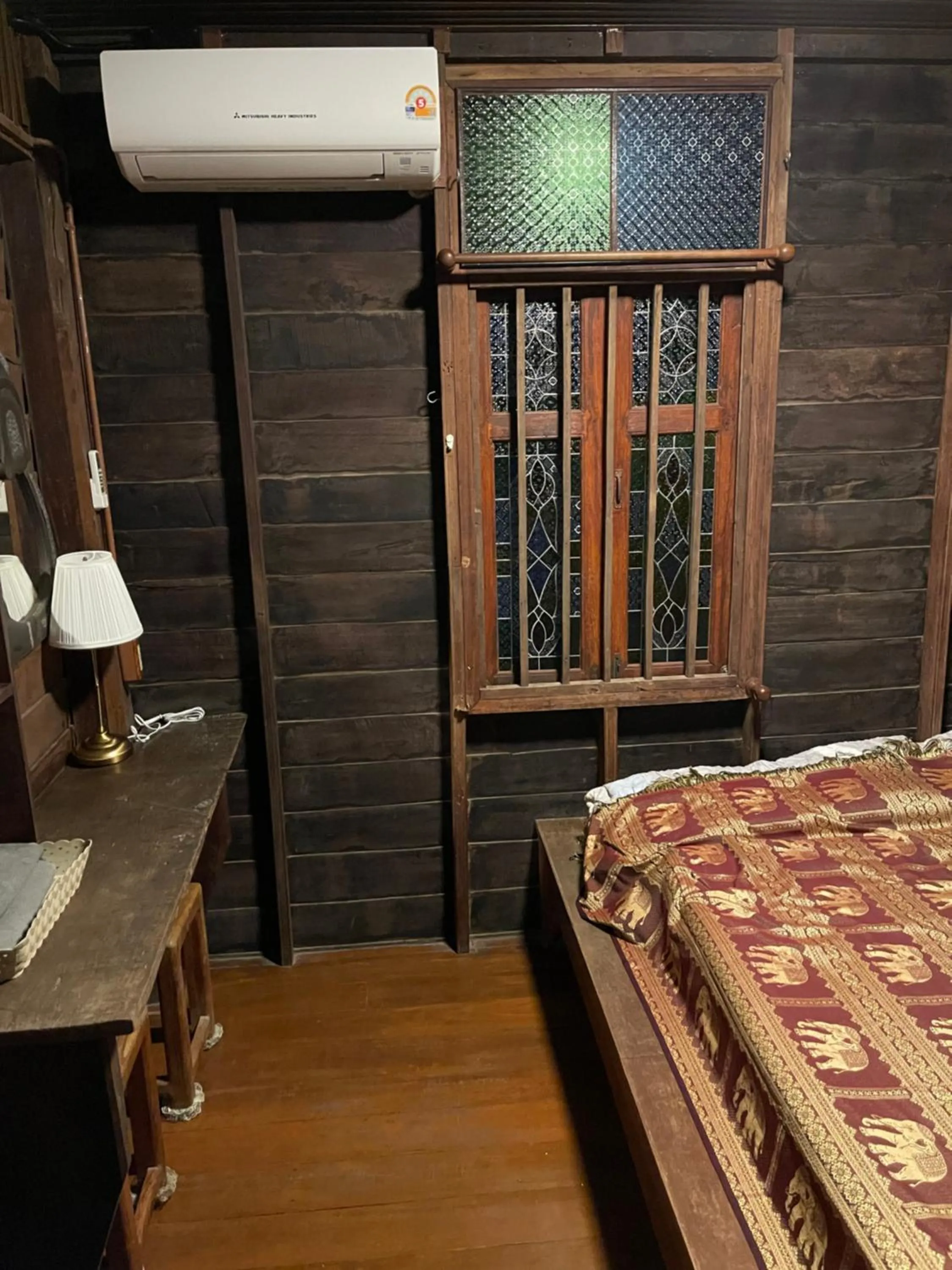 Bed in Ayothaya Riverside House