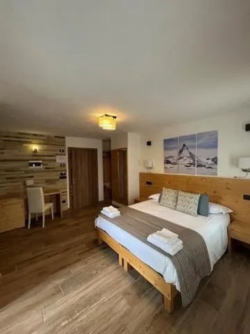 Bed in Edelweiss Hotel Champoluc