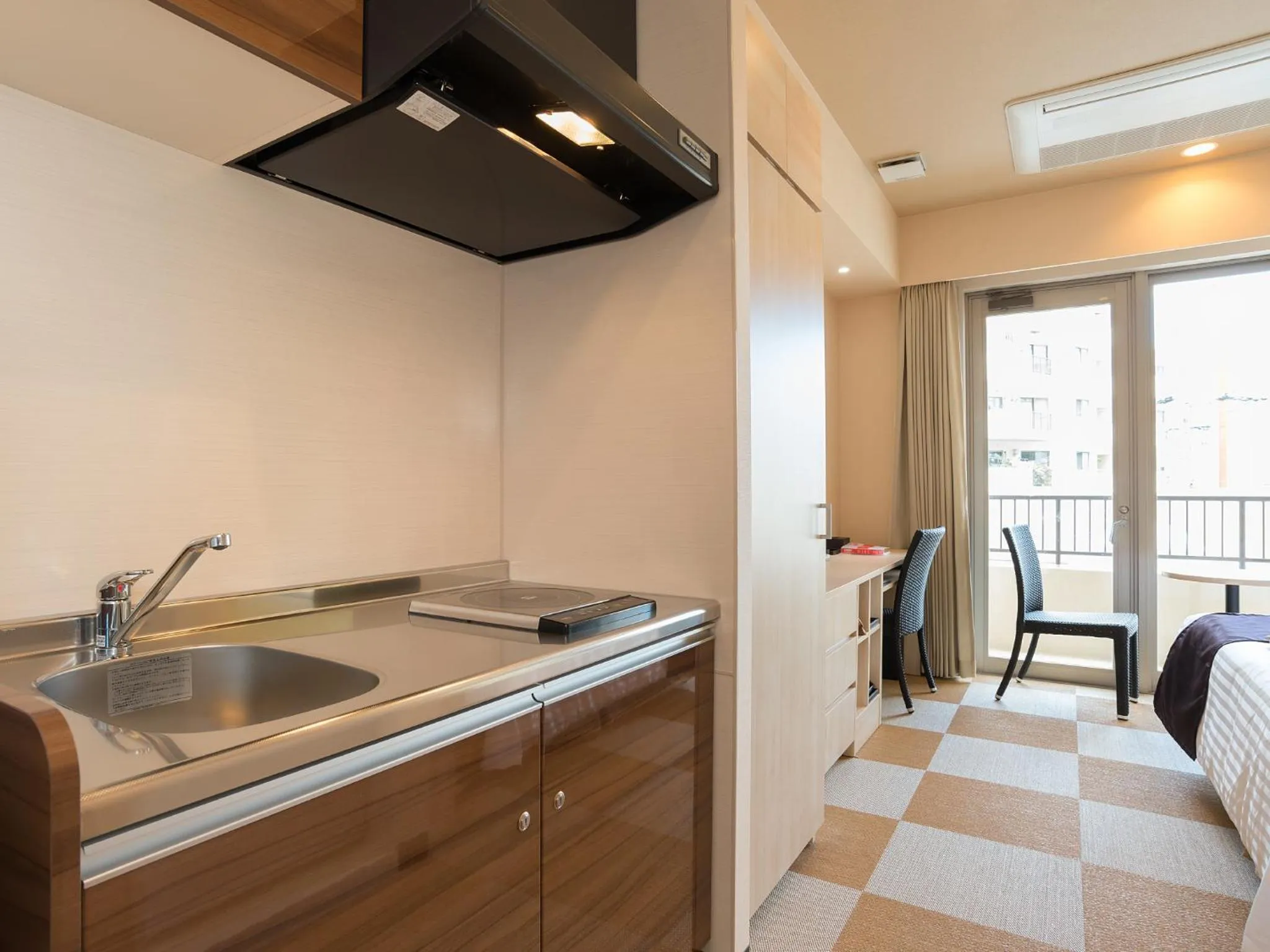 Photo of the whole room in Community & Spa Naha Central Hotel