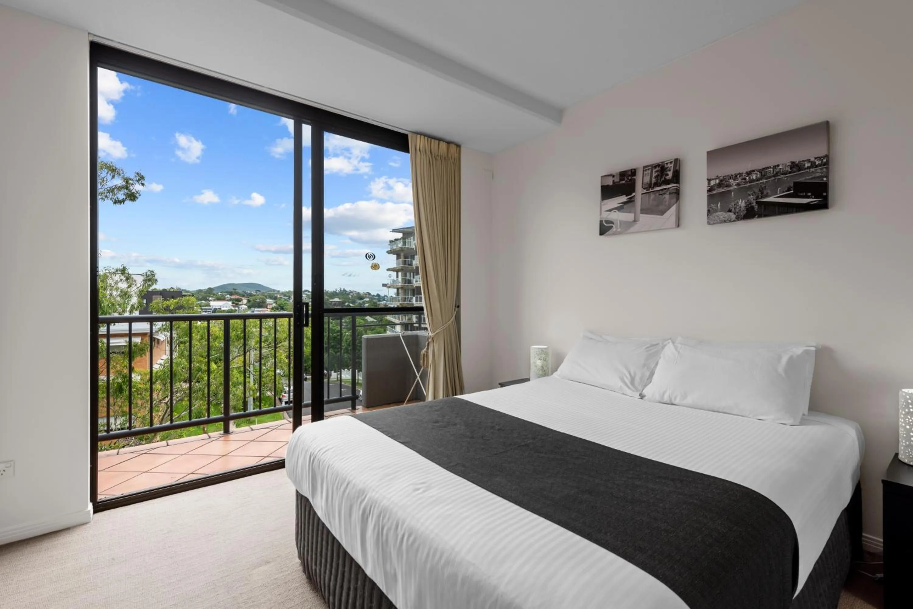 Bed in The Oasis Apartments