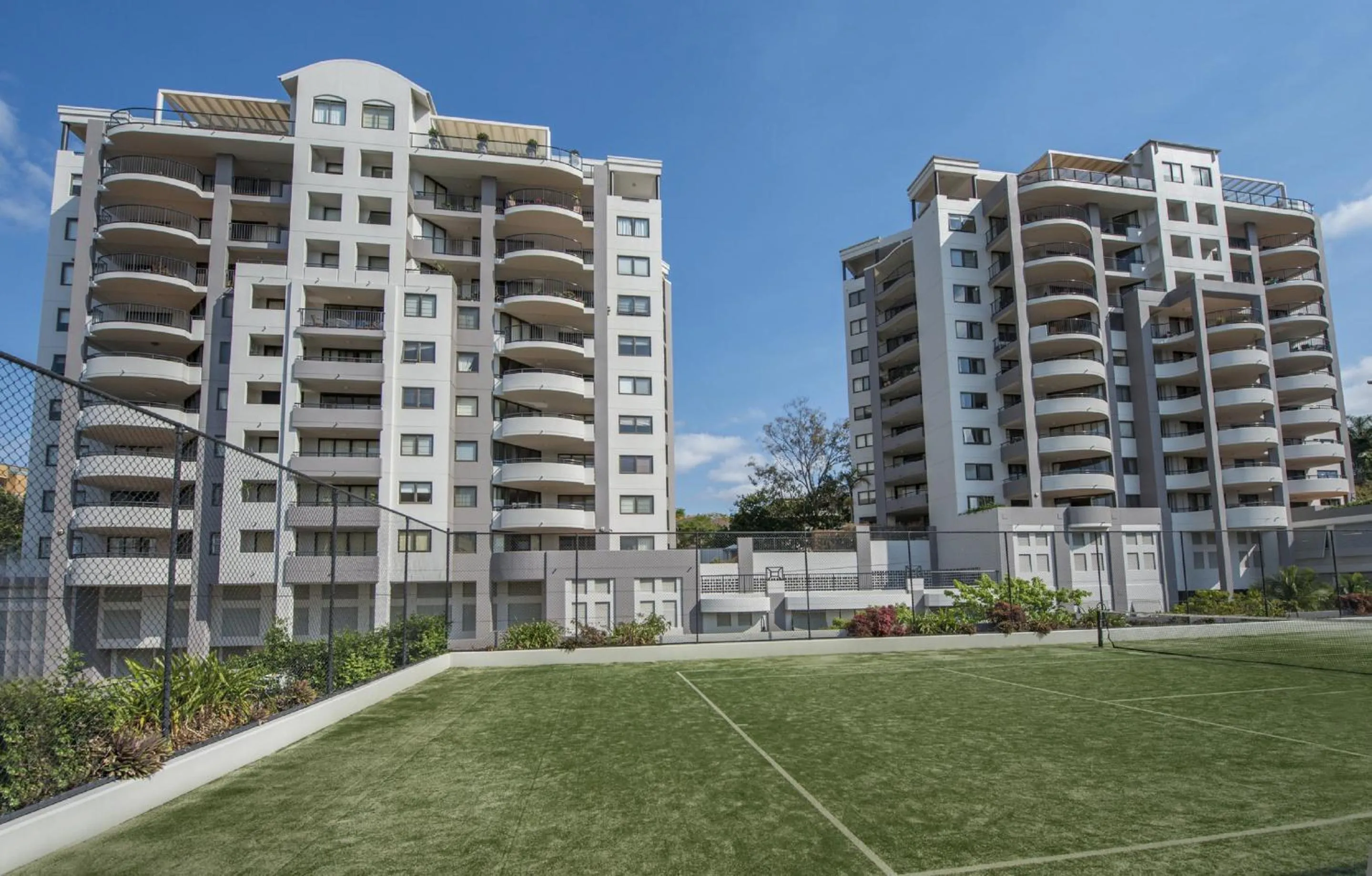 Tennis court in The Oasis Apartments