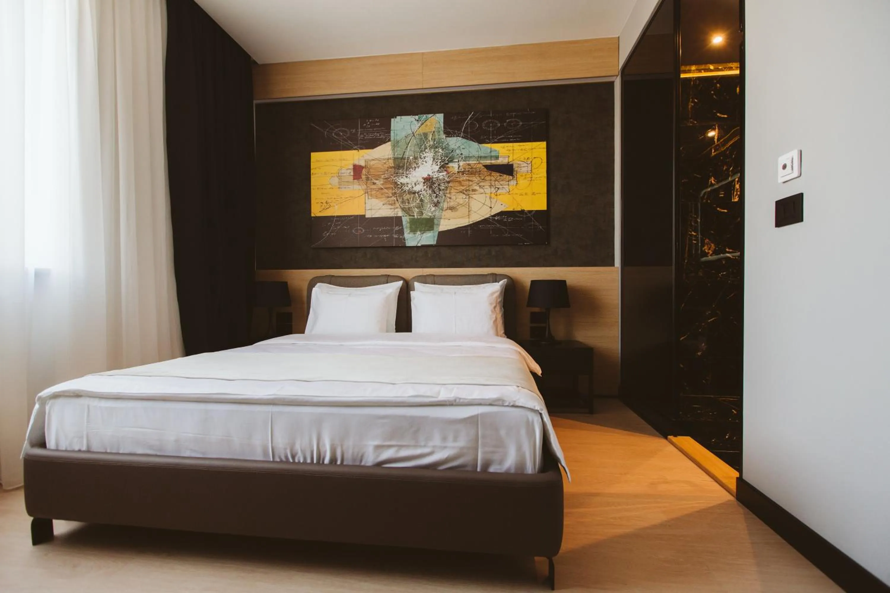 Bed in Maccani Black Luxury Suites