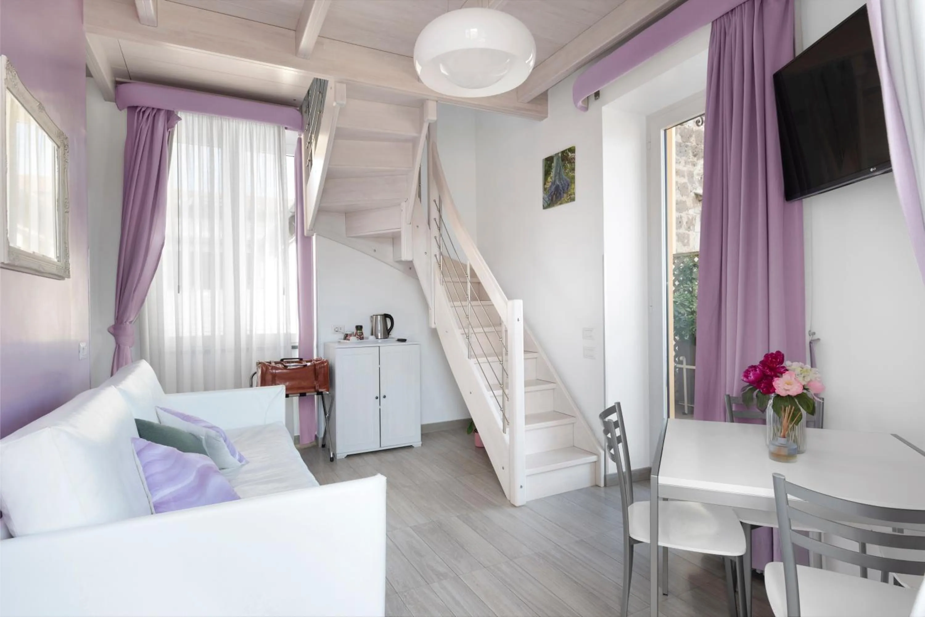 Living room, Bed in Al Centro Suites