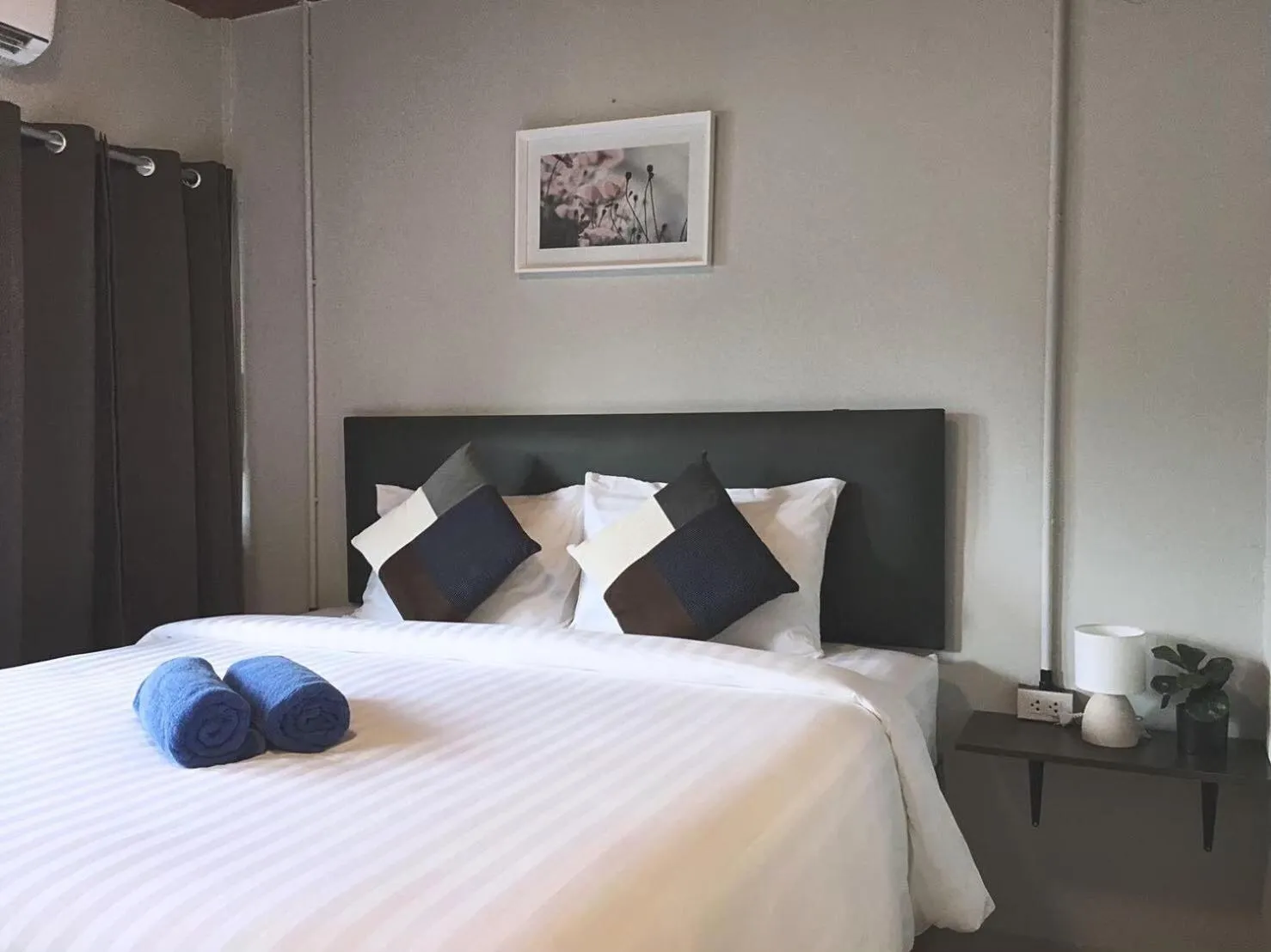 Photo of the whole room, Bed in MOOK BOONCHU HOTEL