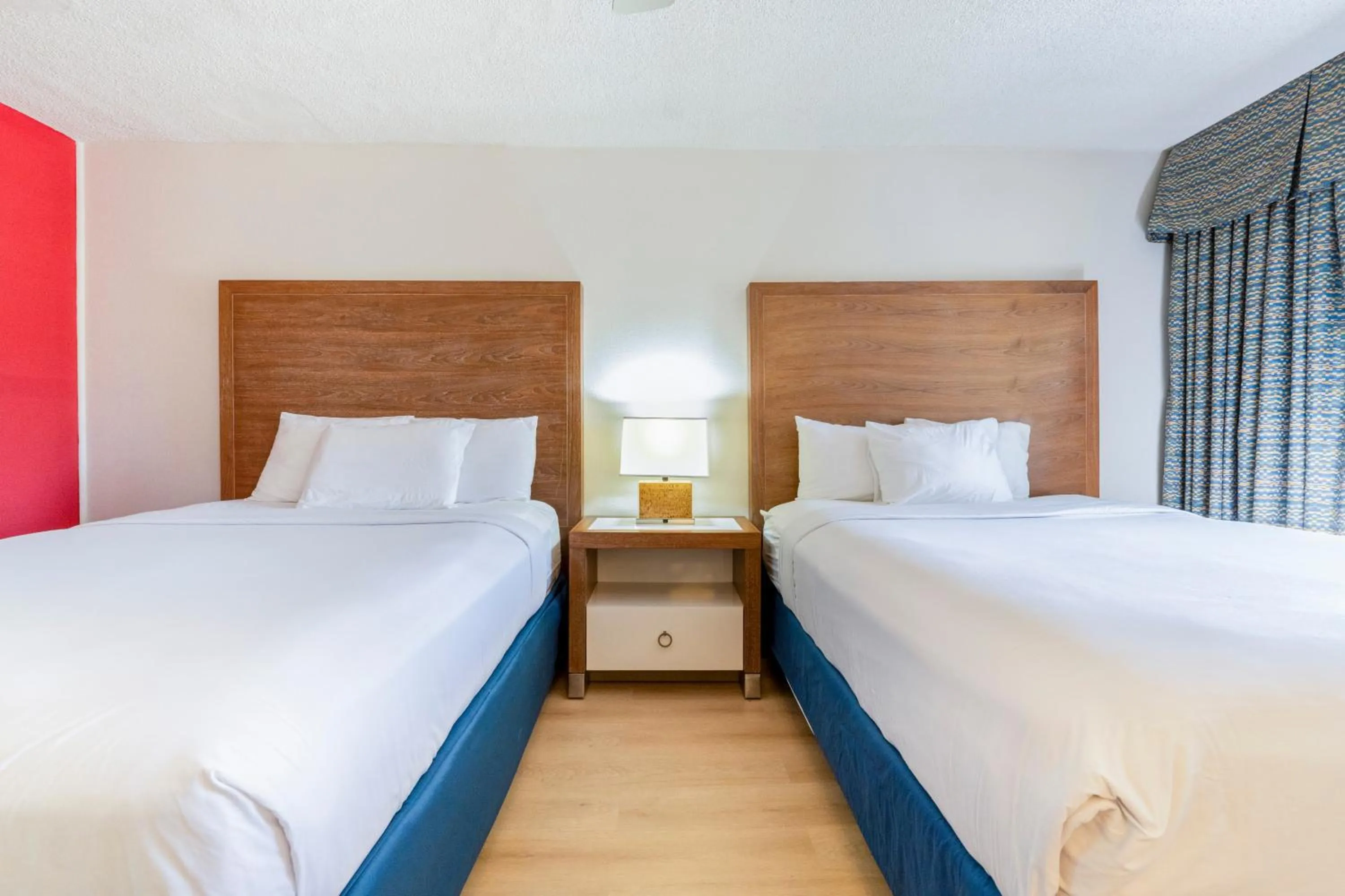 Bedroom, Bed in Ramada by Wyndham Flamingo Water Park