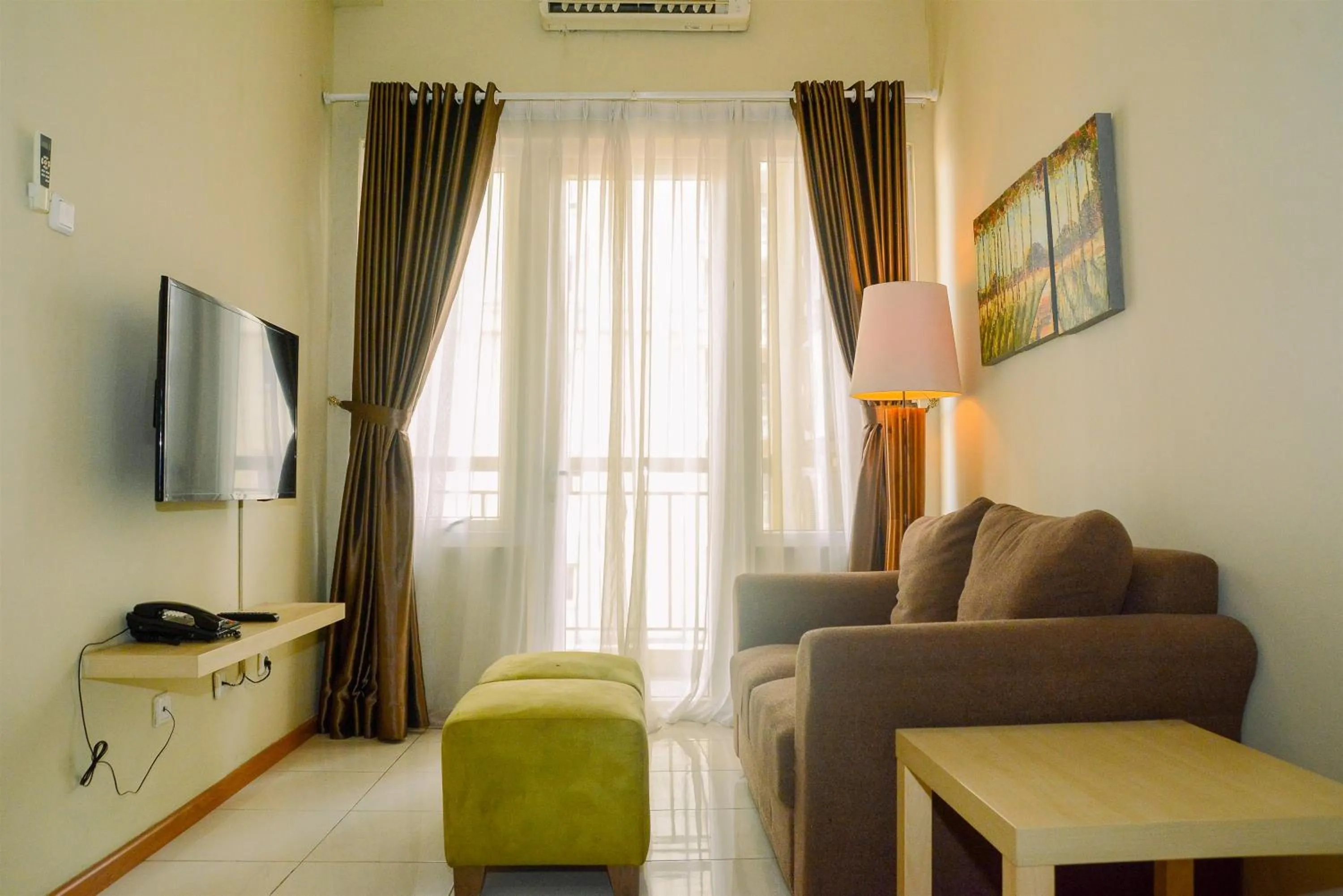 Living room in 3BR Business Residence at Grand Palace Kemayoran Apartment By Travelio