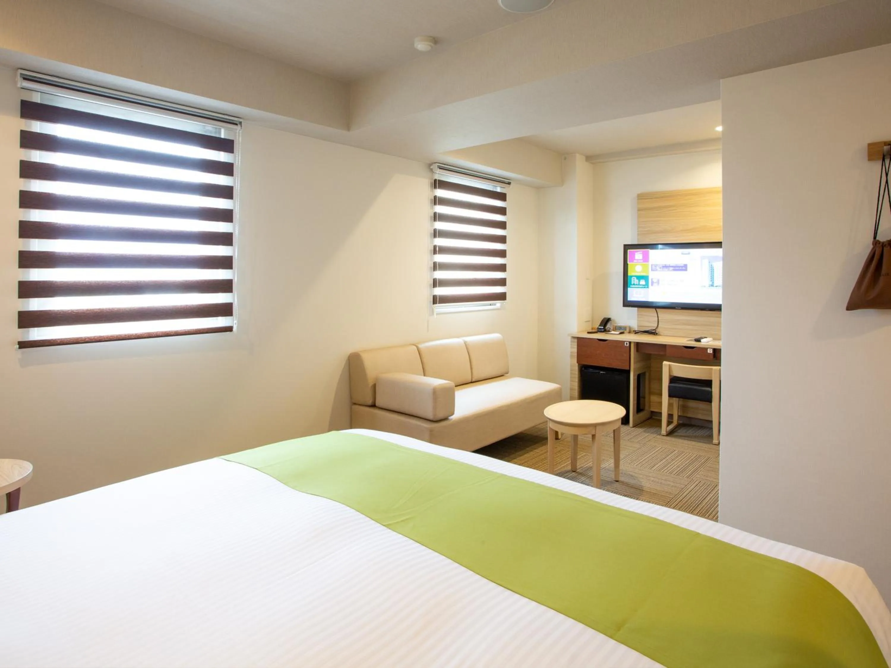 Bed in Kuretake Inn Ogaki Ekimae