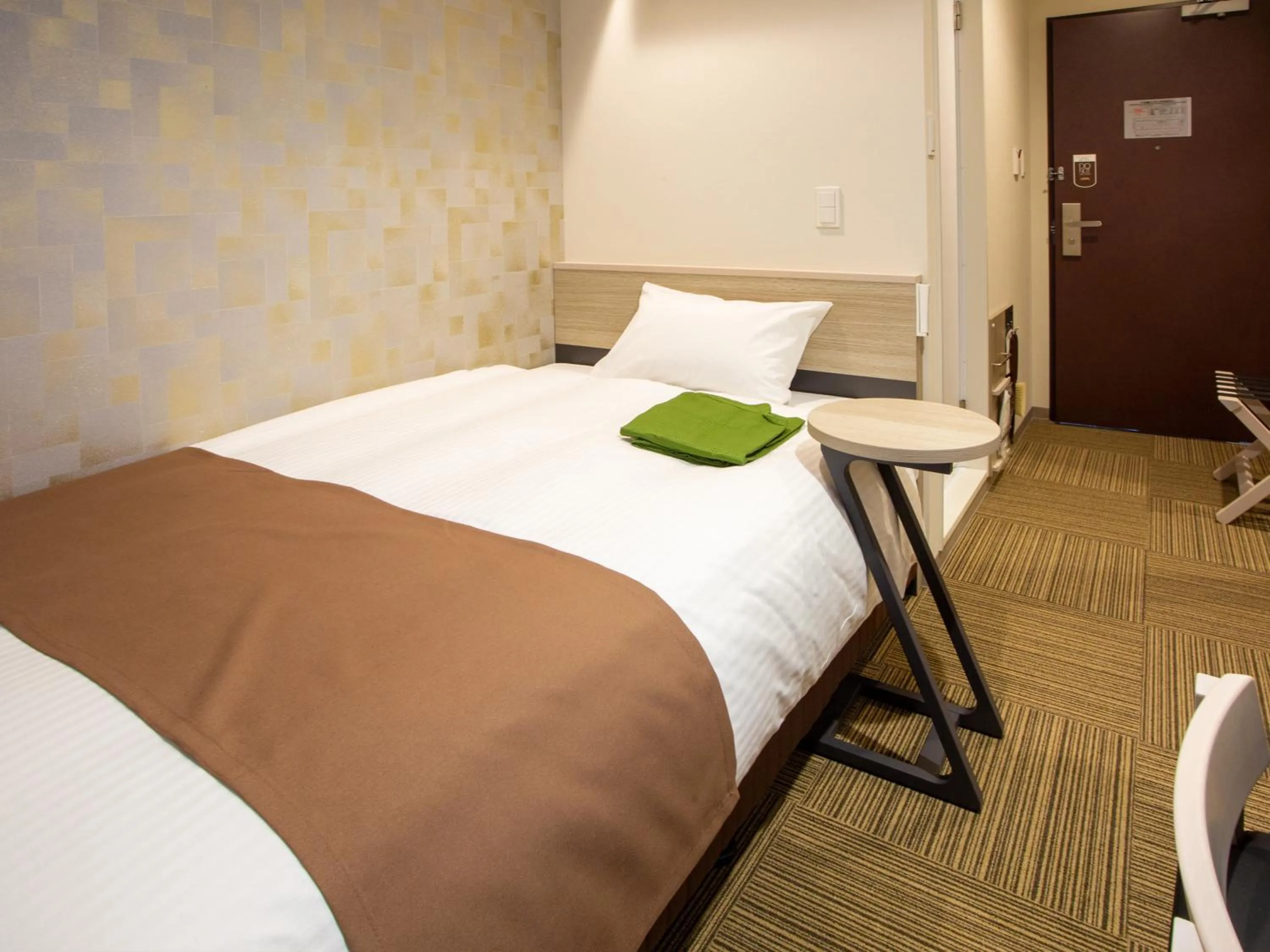 Bed in Kuretake Inn Ogaki Ekimae