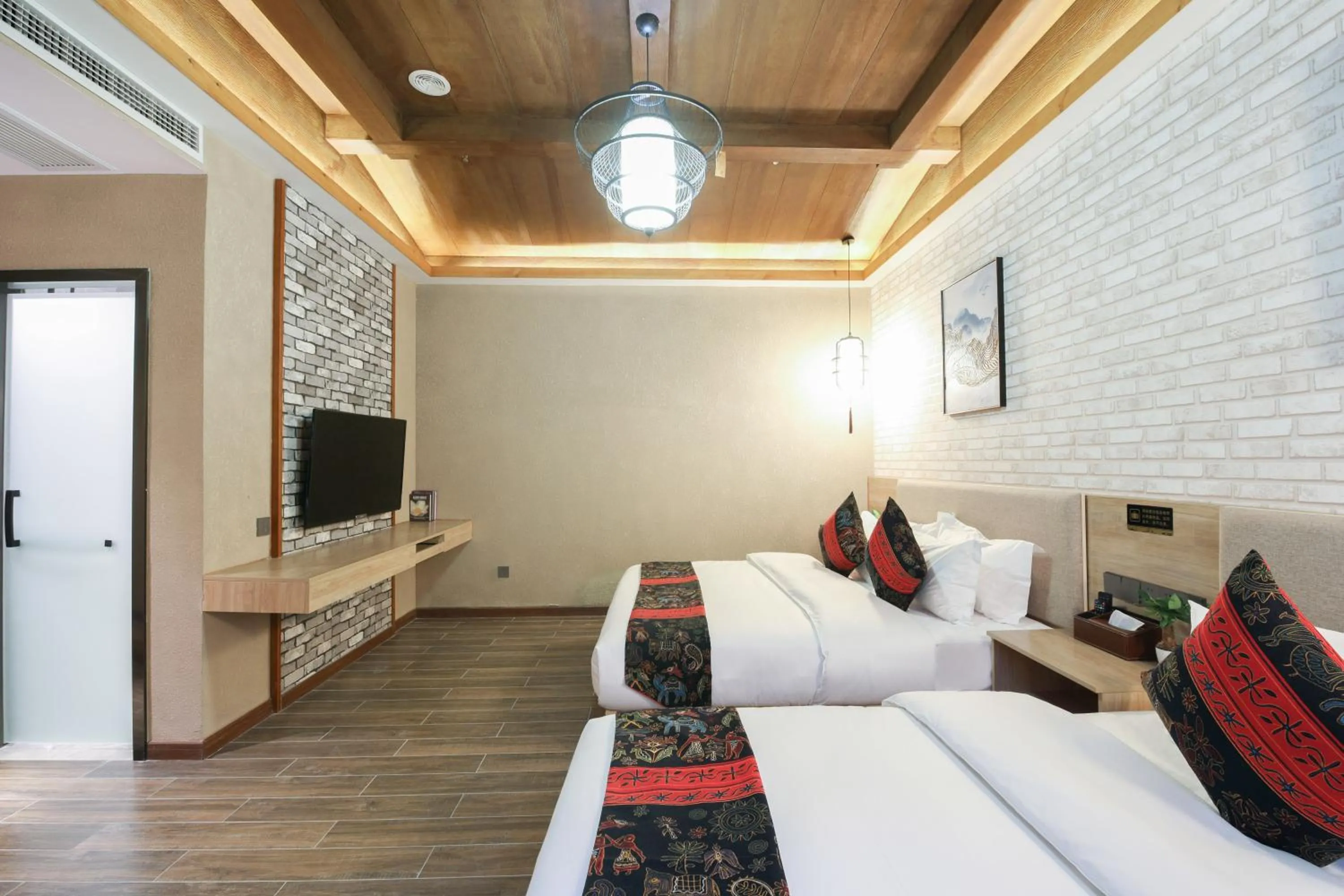 Bed in Zou Qu Ye Travel Hotel