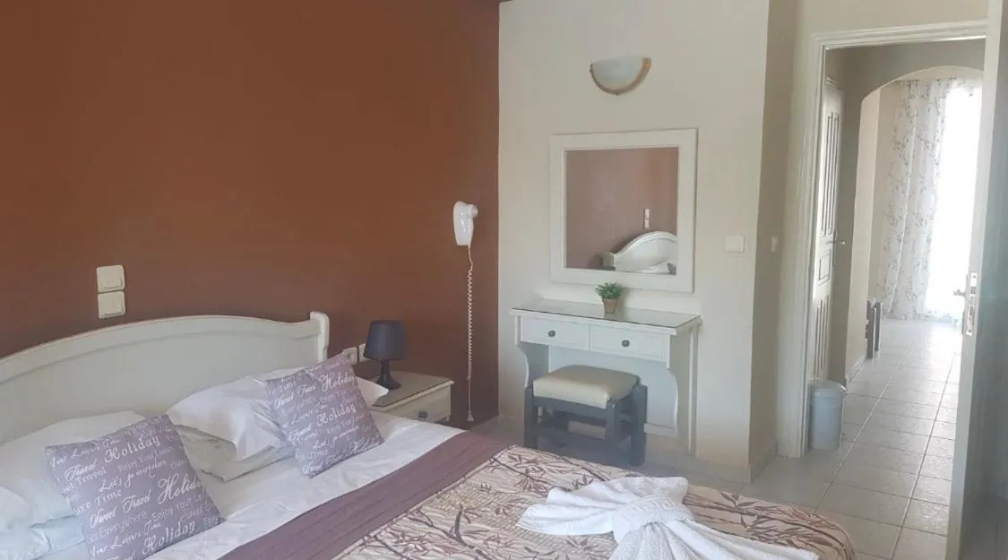 Bed in Poseidon Apartments